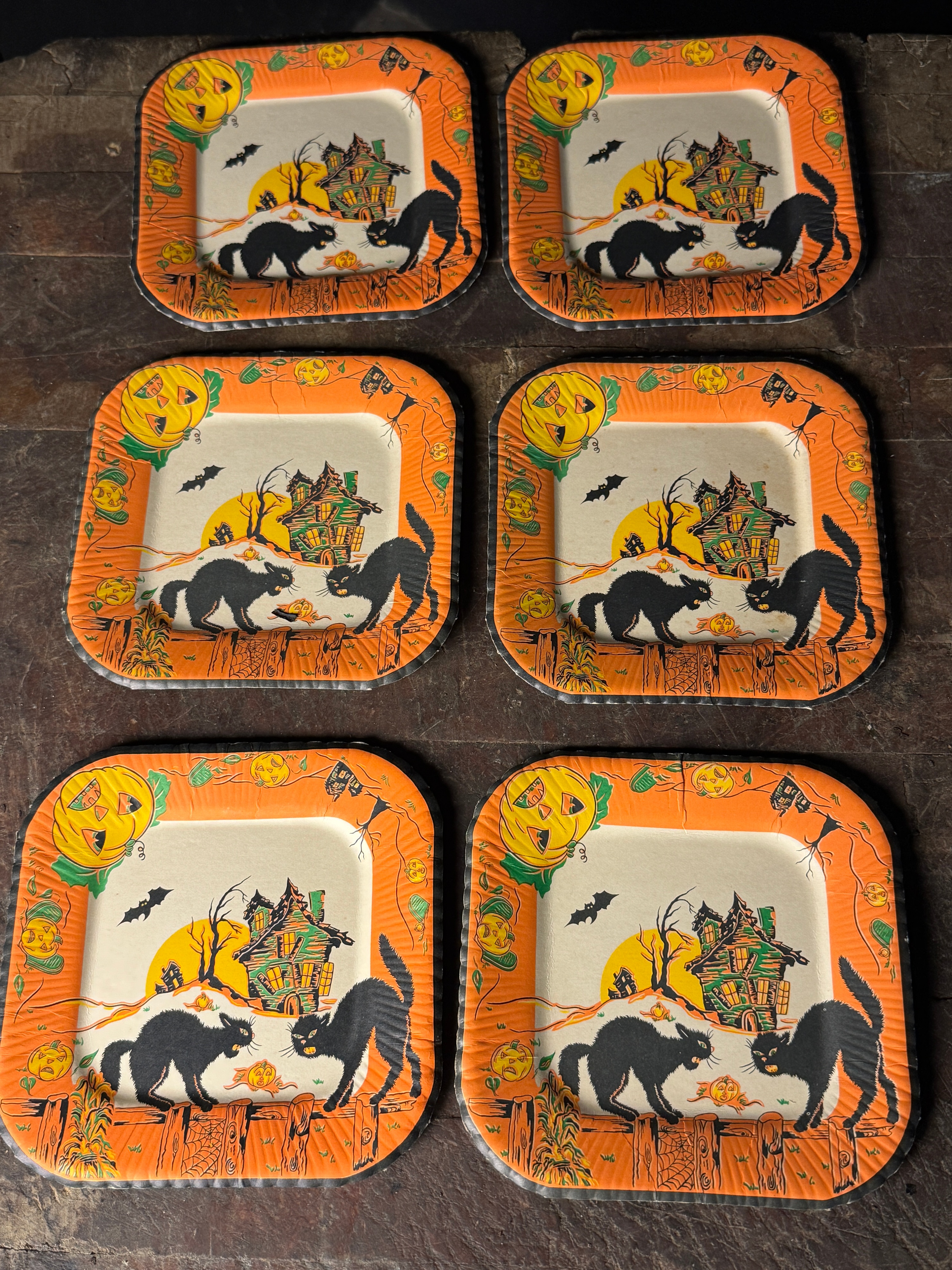 A Set of Six Vintage Halloween Square Paper Plates with Black Cat and Haunted House Motifs