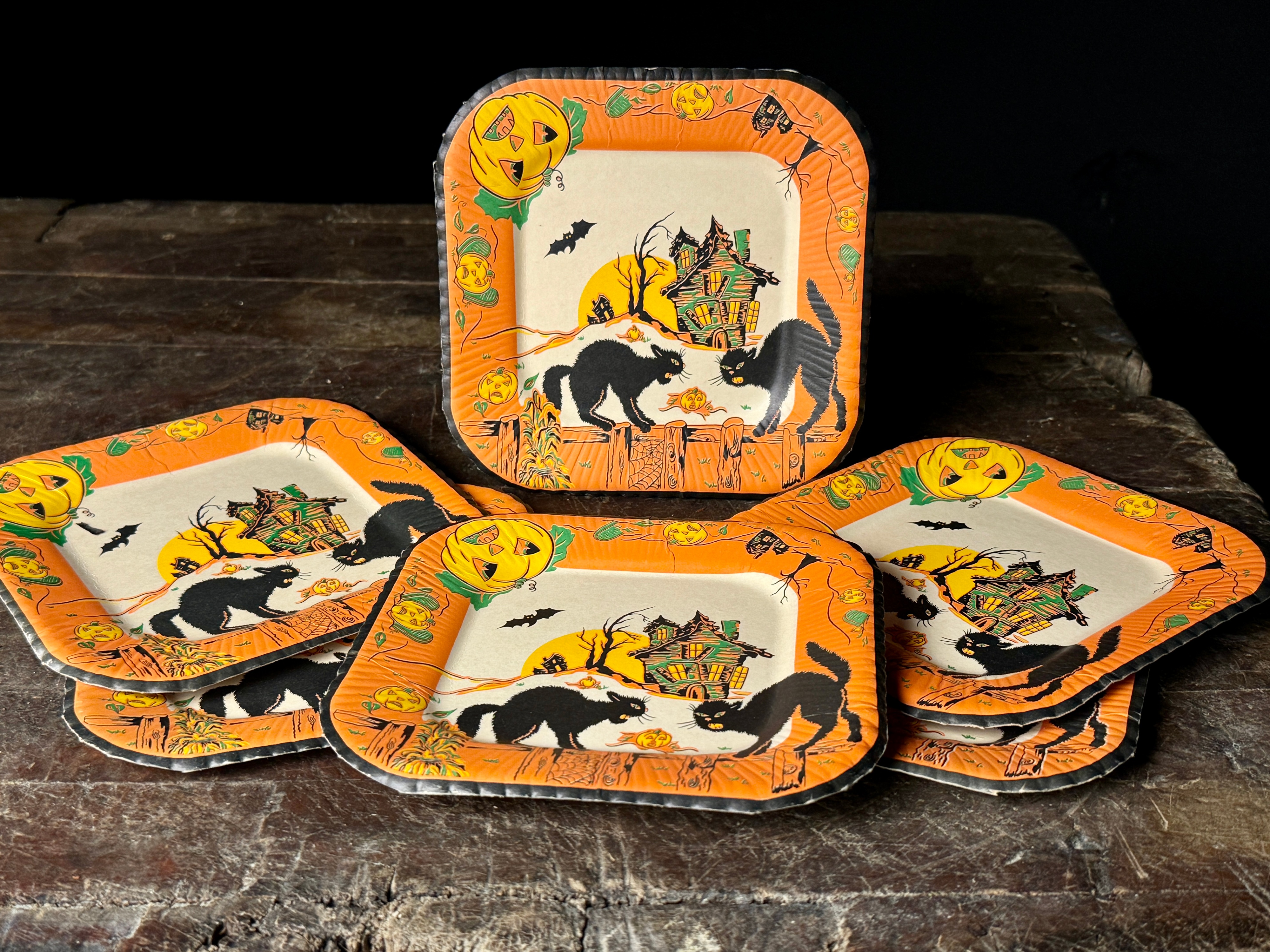 A Set of Six Vintage Halloween Square Paper Plates with Black Cat and Haunted House Motifs