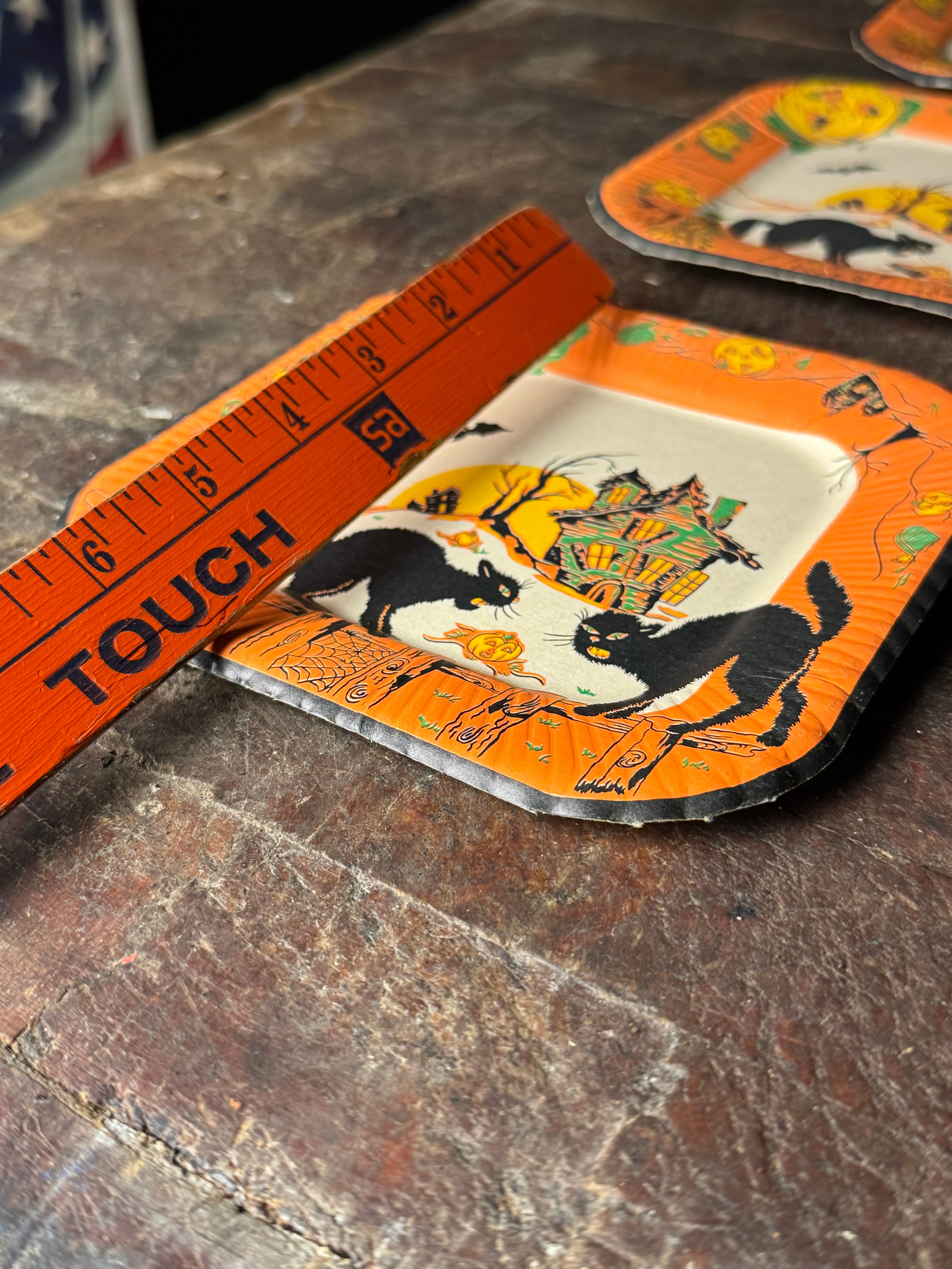 A Set of Six Vintage Halloween Square Paper Plates with Black Cat and Haunted House Motifs