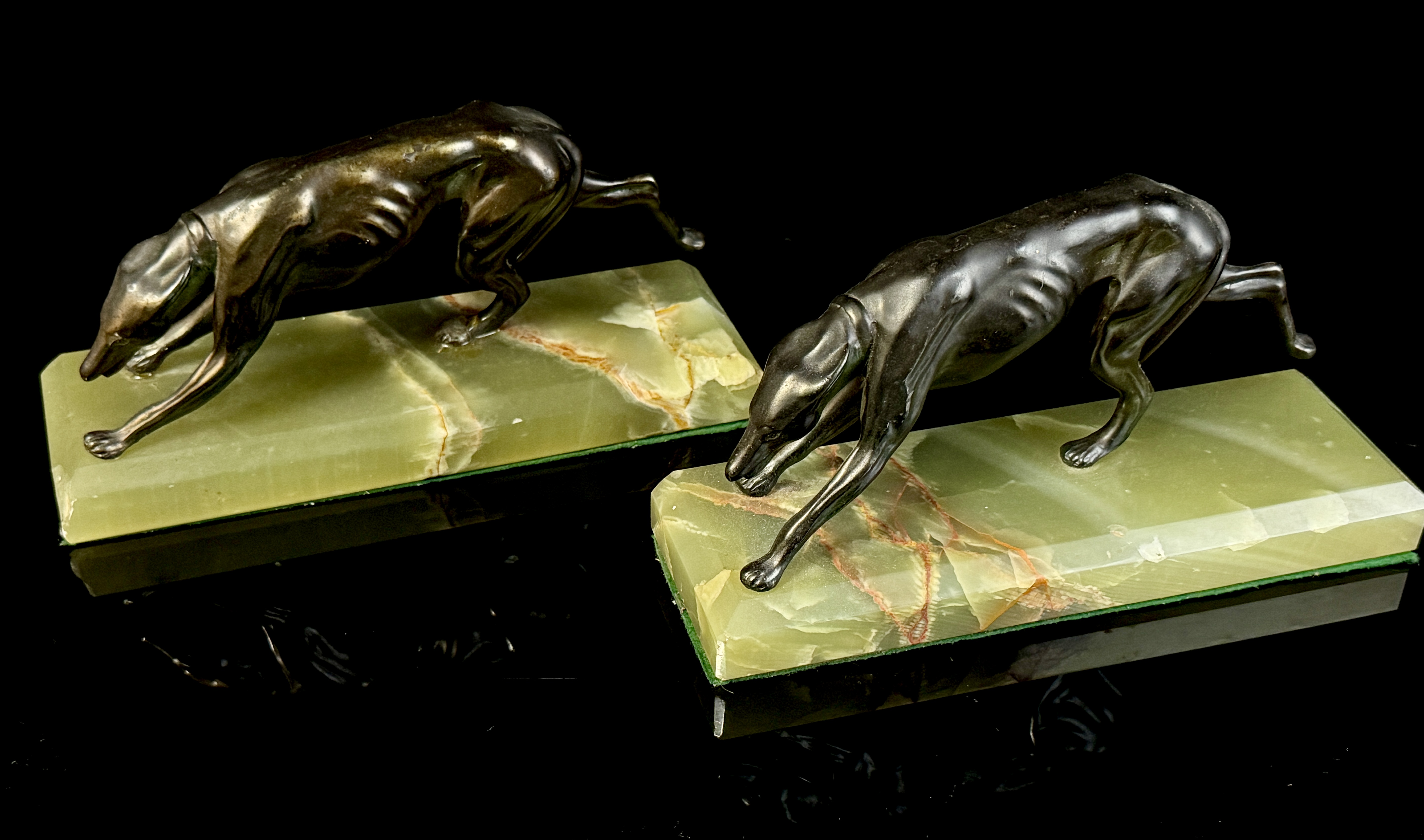 A Pair of Art Deco Bronze Greyhound Bookends on Onyx Bases