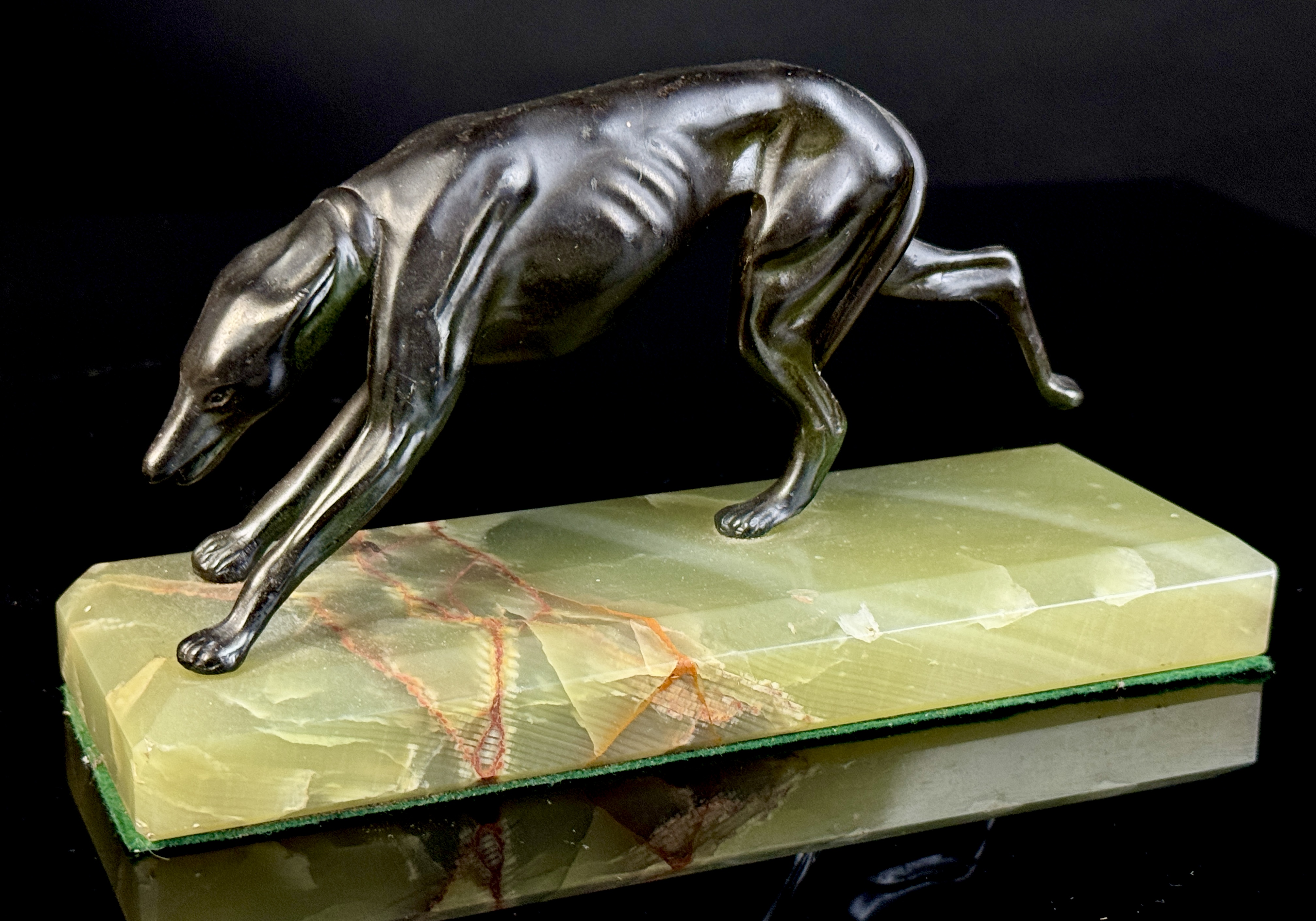 A Pair of Art Deco Bronze Greyhound Bookends on Onyx Bases