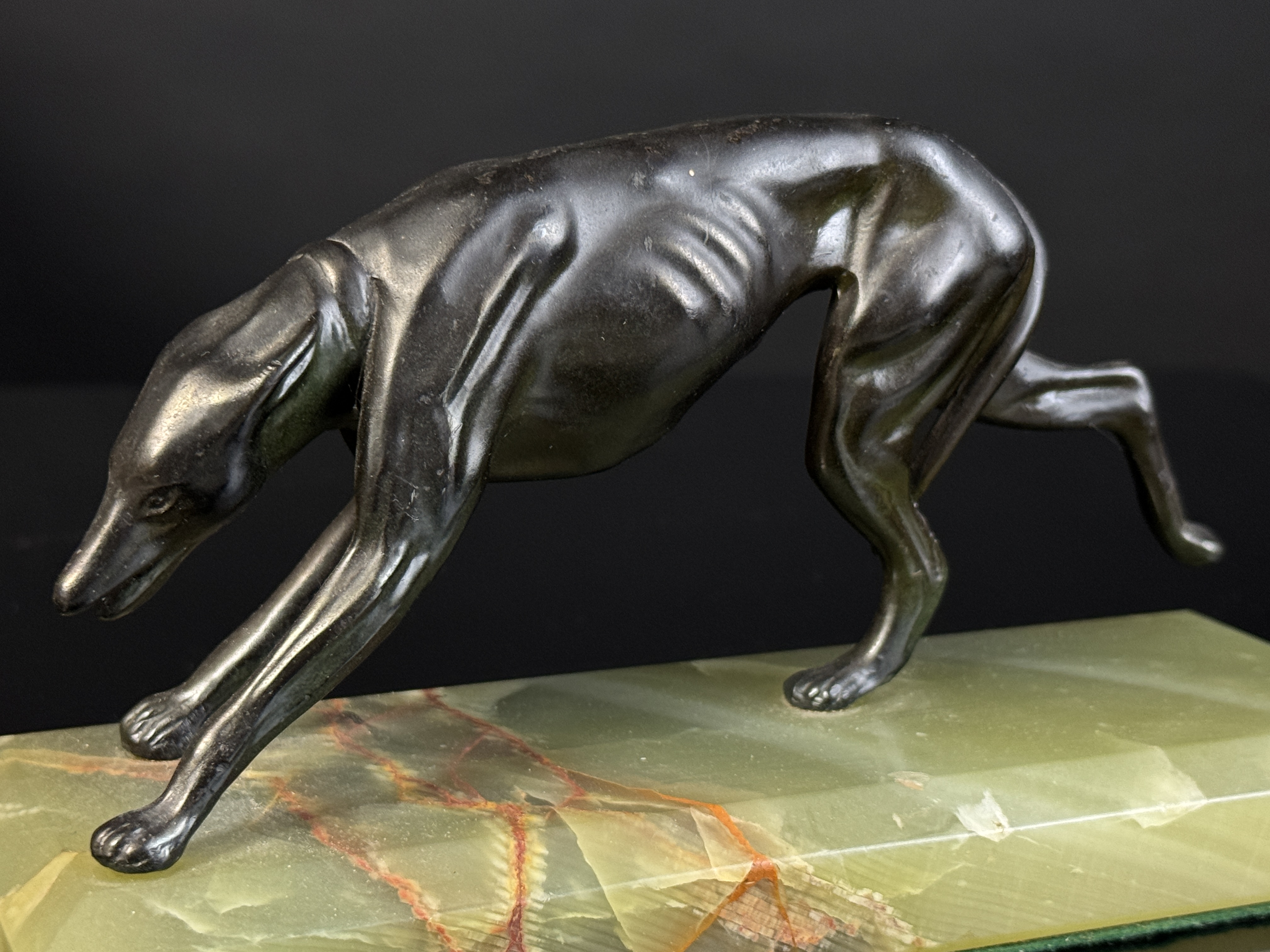 A Pair of Art Deco Bronze Greyhound Bookends on Onyx Bases