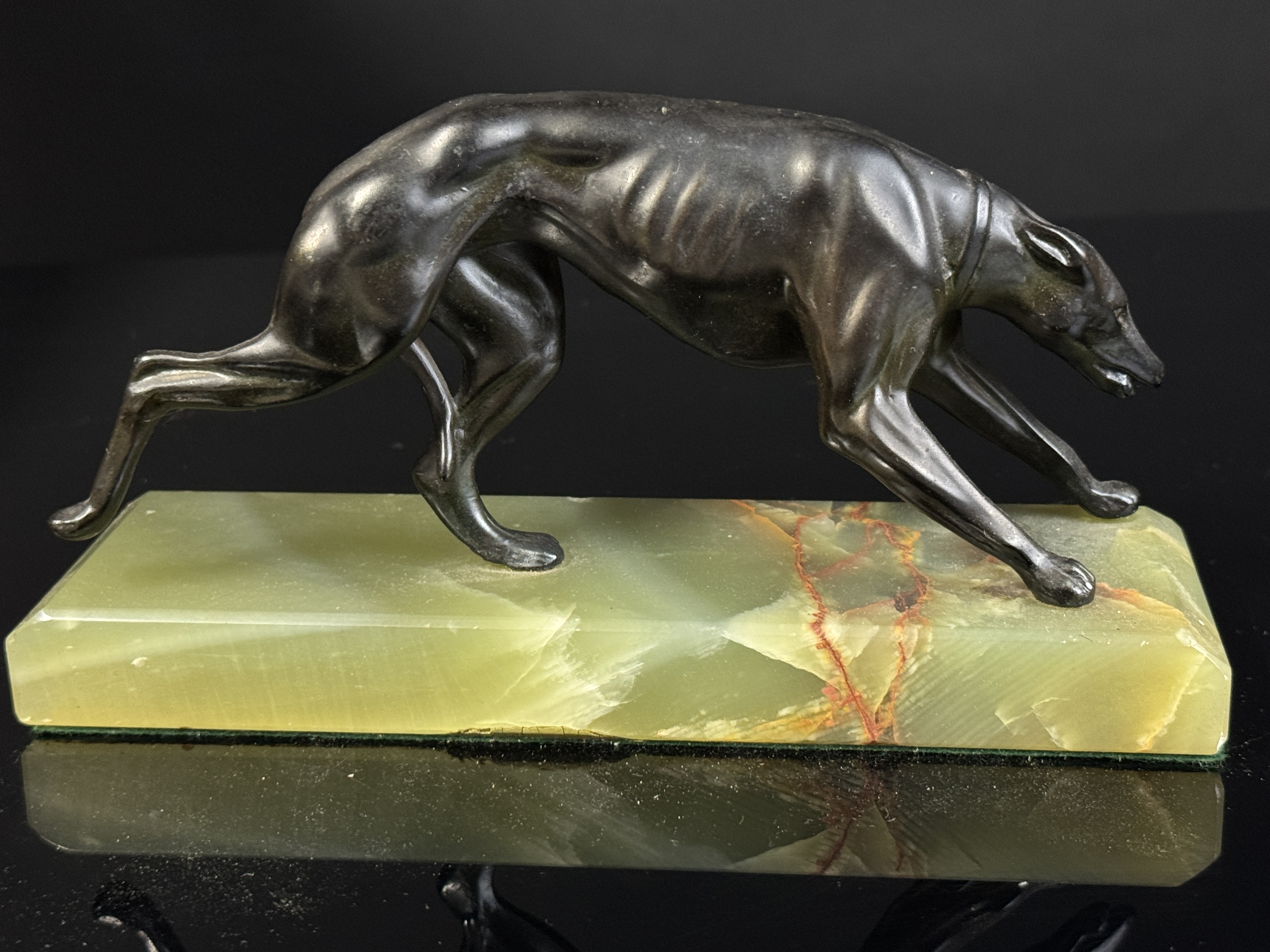 A Pair of Art Deco Bronze Greyhound Bookends on Onyx Bases