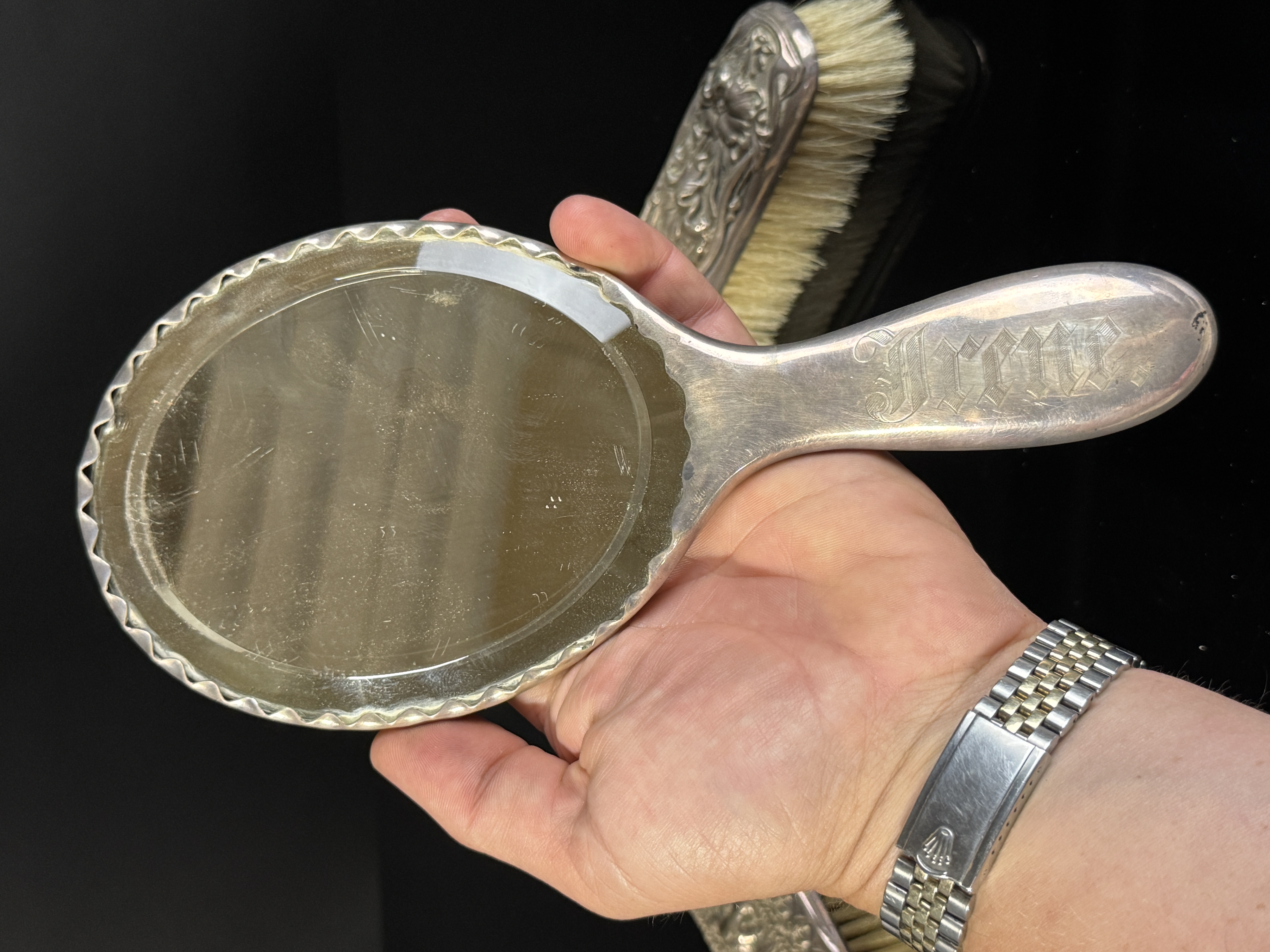 A Three-Piece Gorham Manufacturing Company Sterling Silver Floral Repousse Vanity Dresser Set