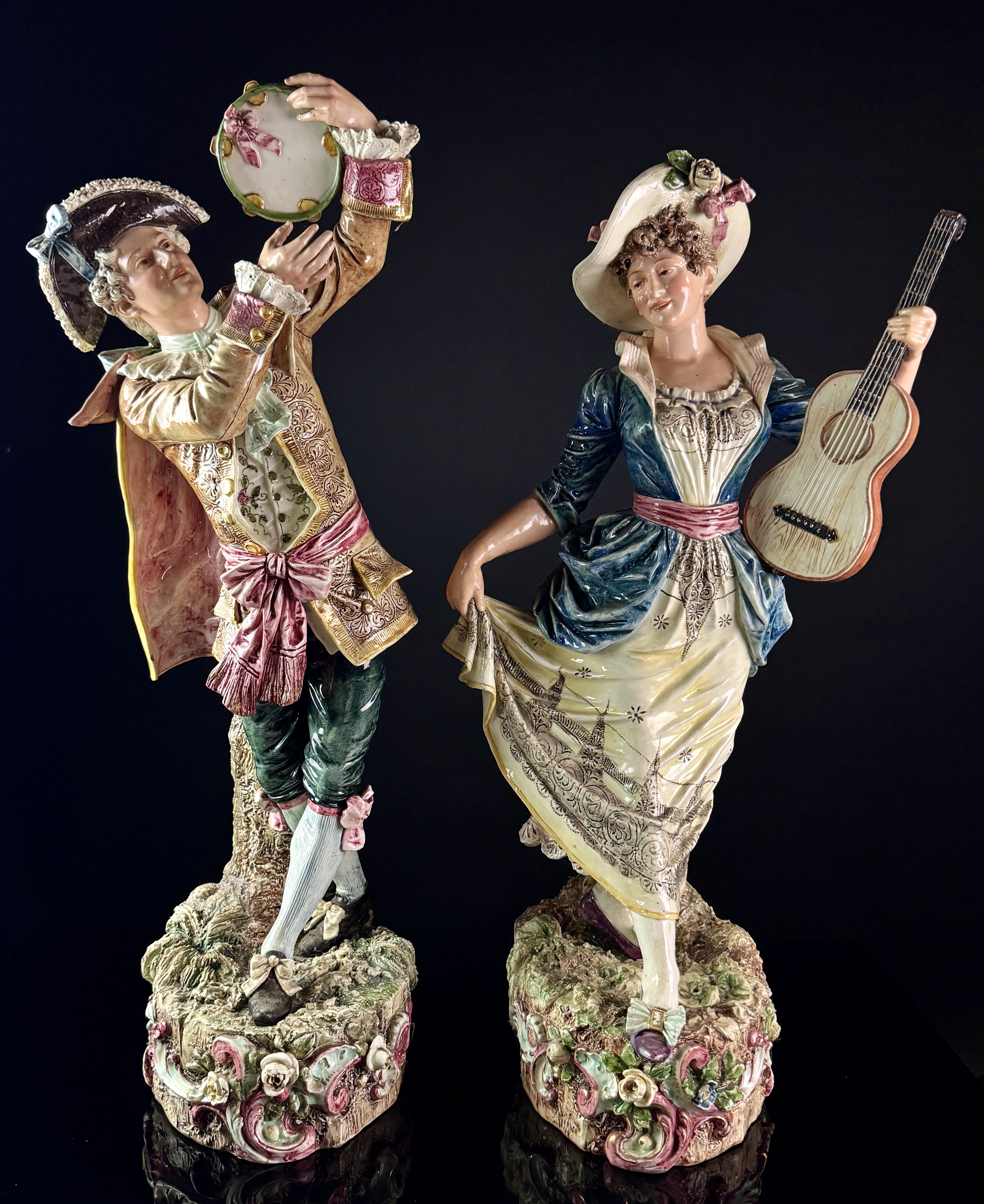 A Pair of Large Continental Polychrome Porcelain Musician Figurines