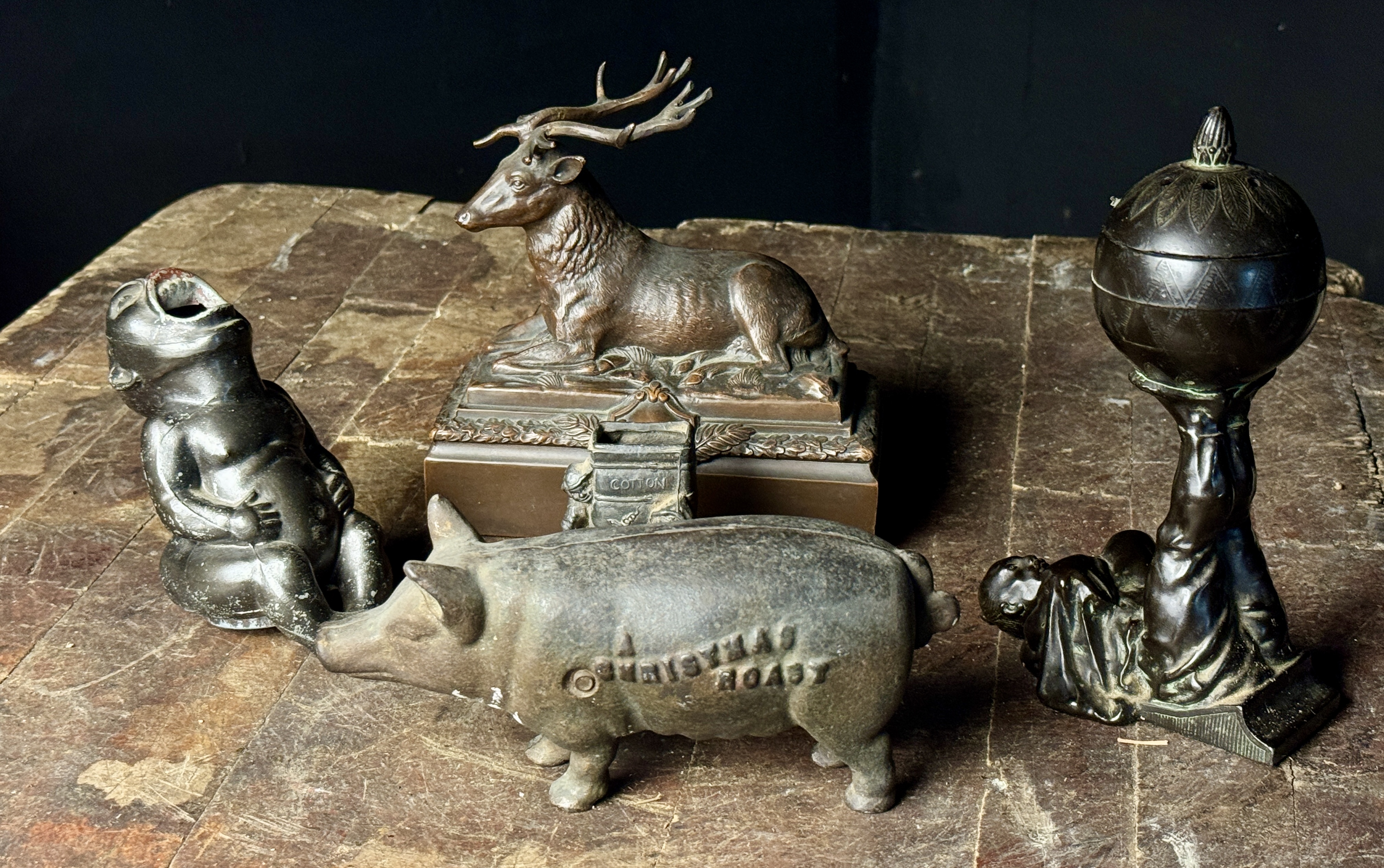 An Assortment of Cast Metal Figurines Including Johann Baptist Stiglmaier Stag and A Christmas Roast Pig Bank