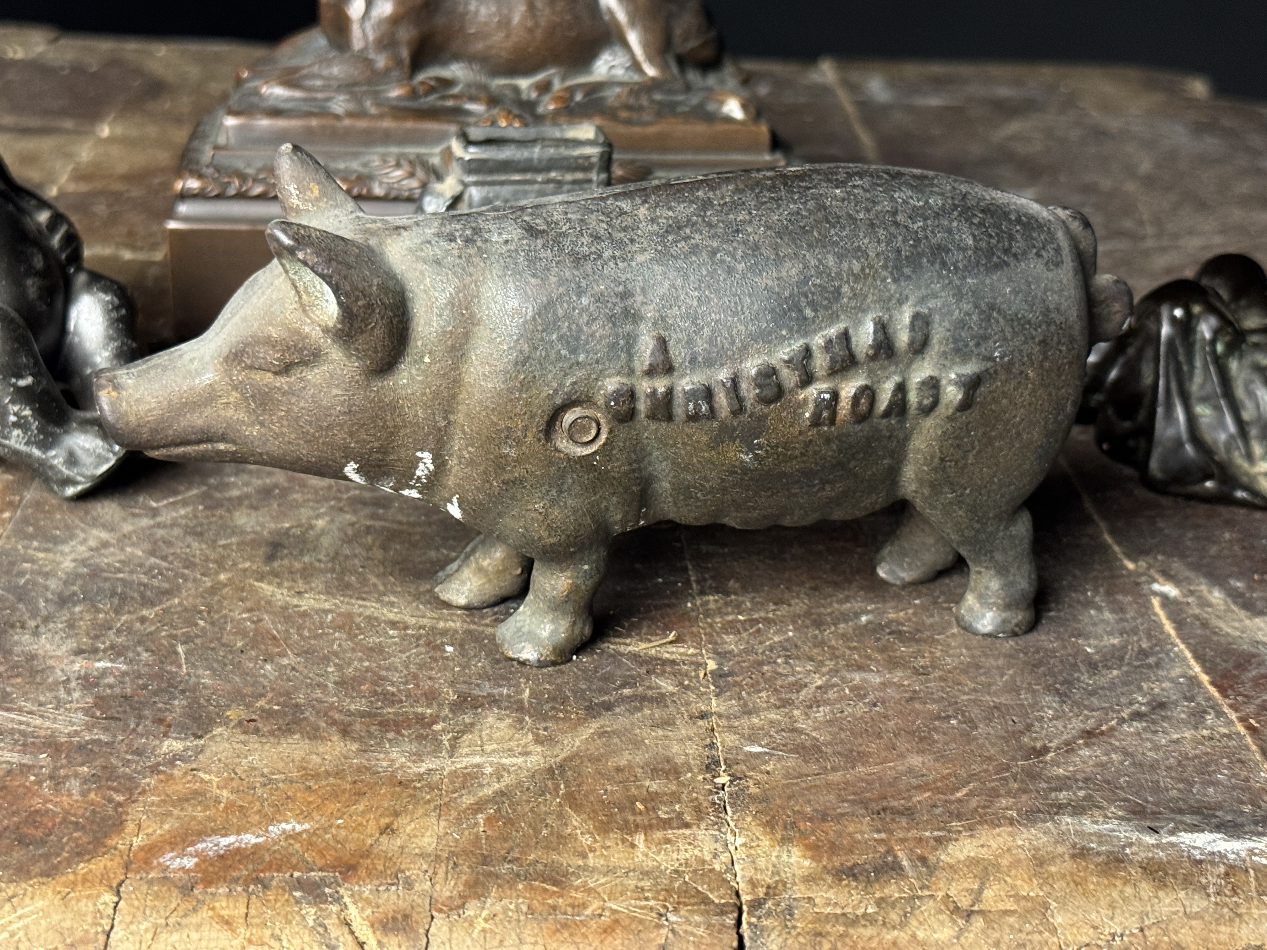 An Assortment of Cast Metal Figurines Including Johann Baptist Stiglmaier Stag and A Christmas Roast Pig Bank