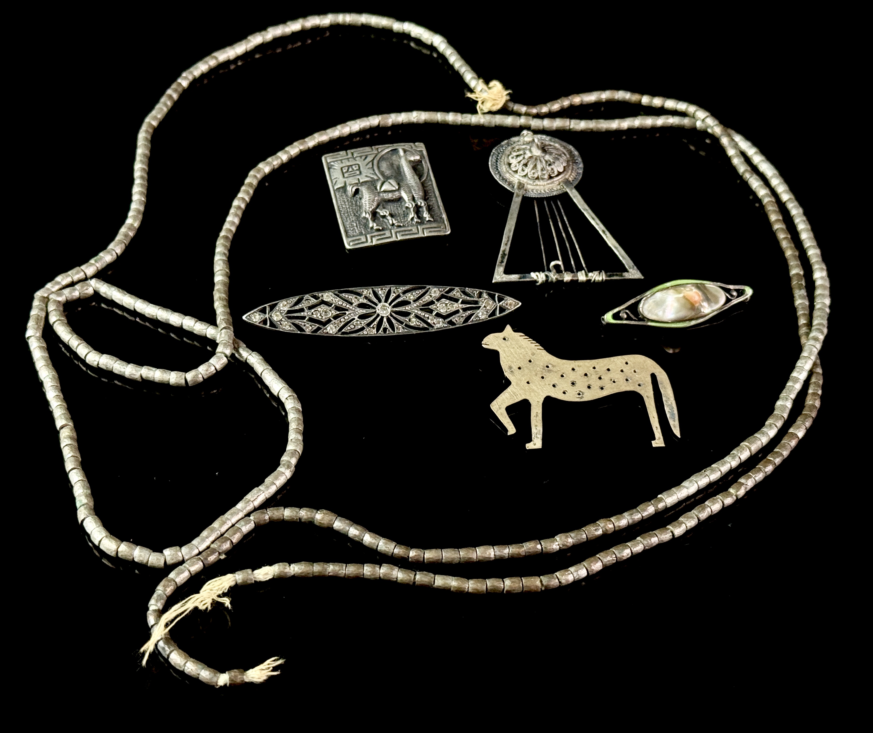 A Collection of Silver Jewelry Including Art Deco Style Brooches and Tribal Style Beads