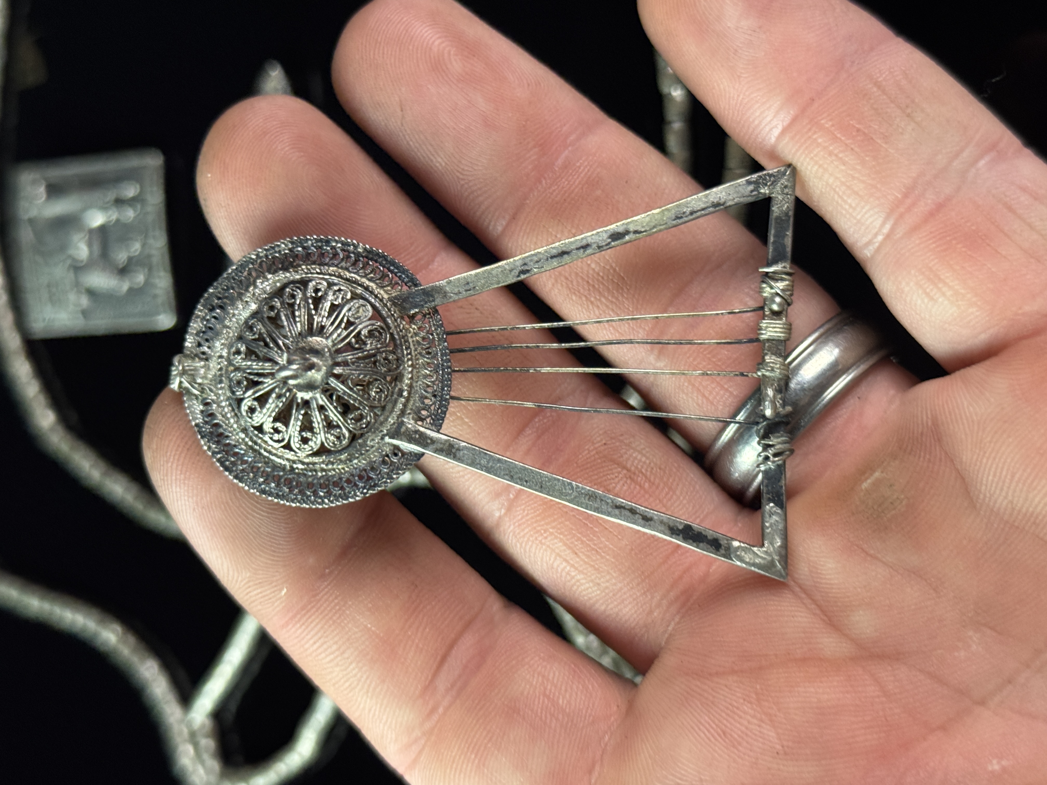 A Collection of Silver Jewelry Including Art Deco Style Brooches and Tribal Style Beads