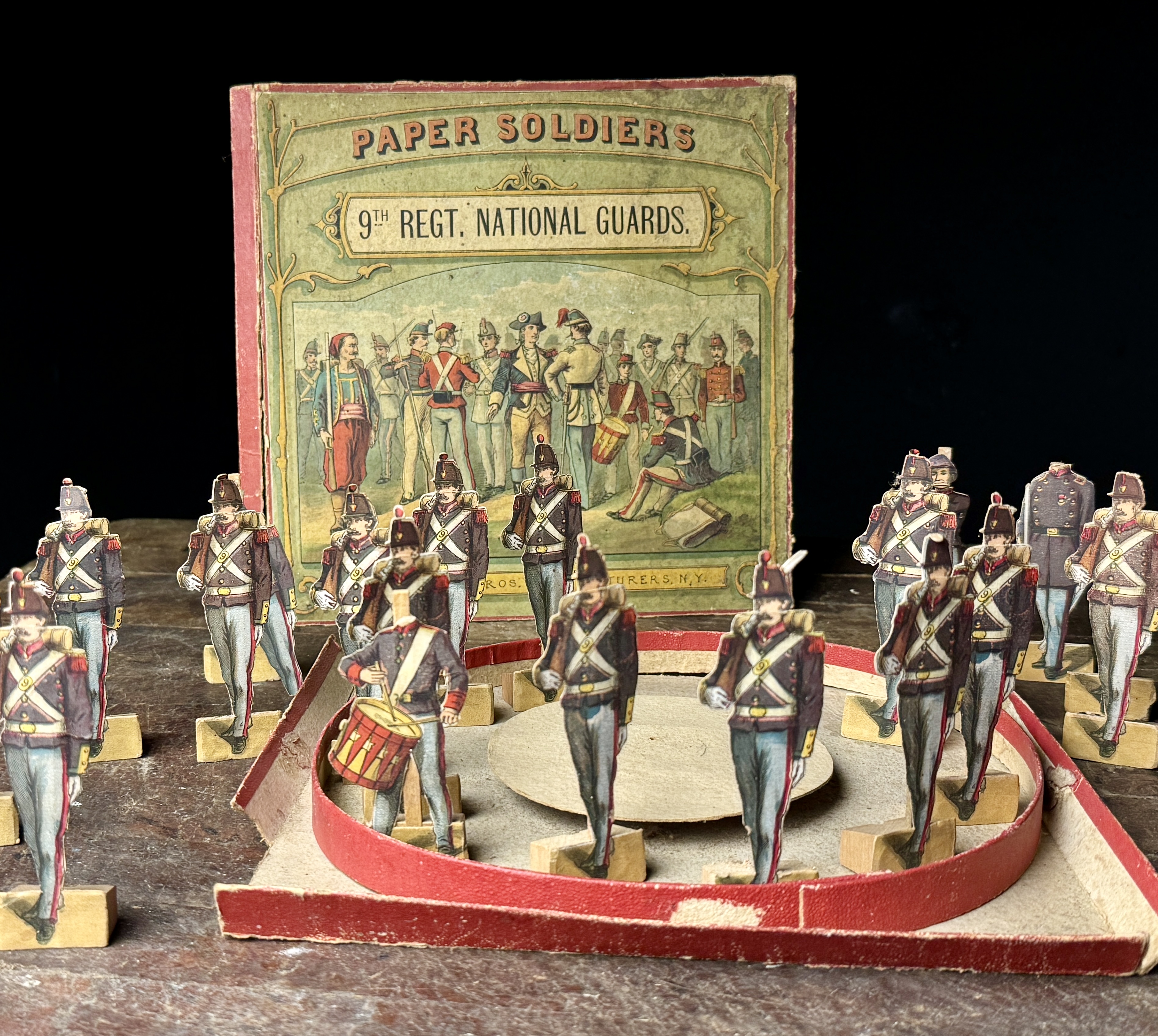 A Set of McLoughlin Bros. 9th Regt. National Guards Mechanical Paper Soldiers with Box Lid