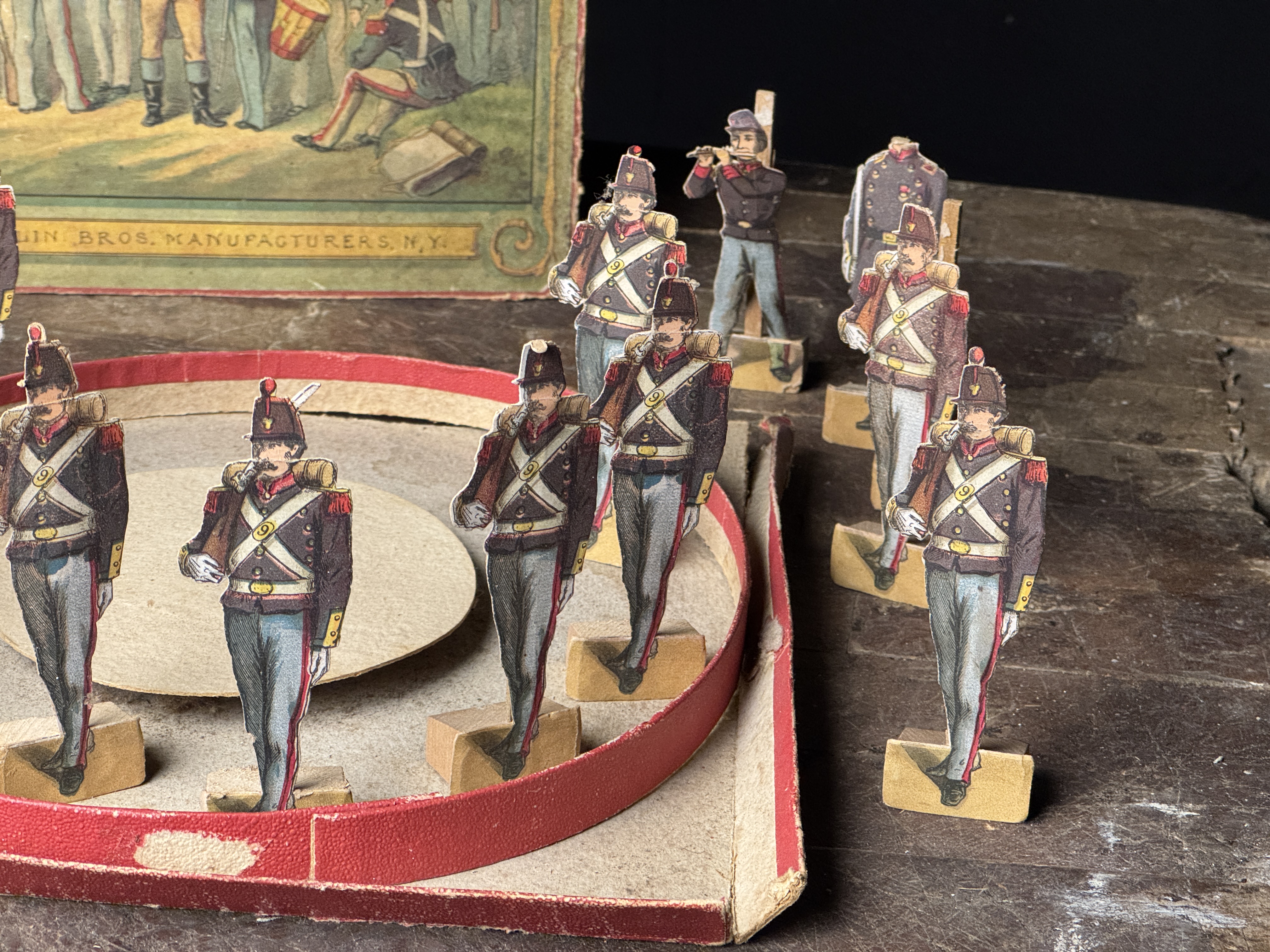 A Set of McLoughlin Bros. 9th Regt. National Guards Mechanical Paper Soldiers with Box Lid