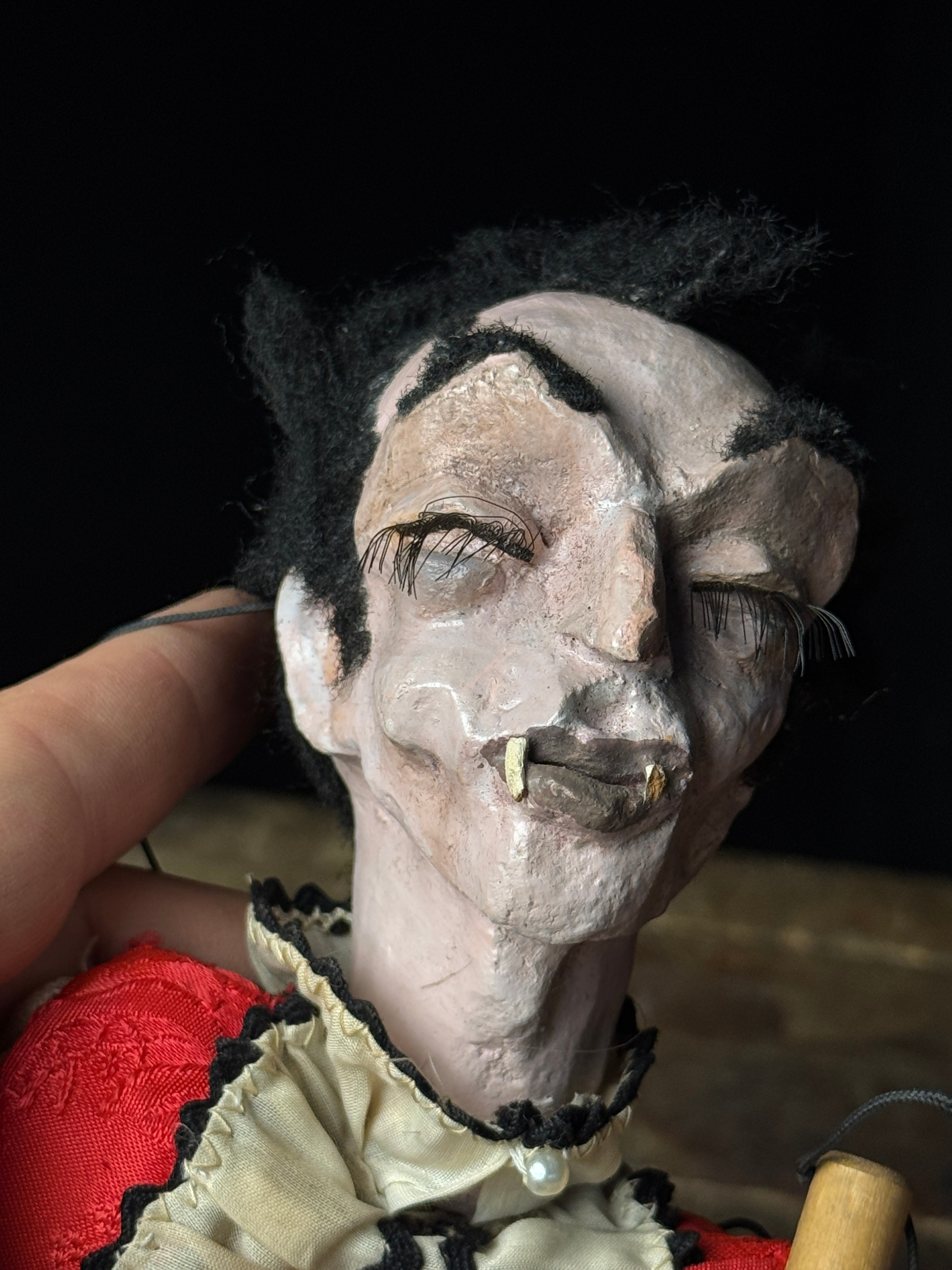 A Pair of Vintage Composition and Wood Marionettes Featuring Vampire and Sad Clown Characters