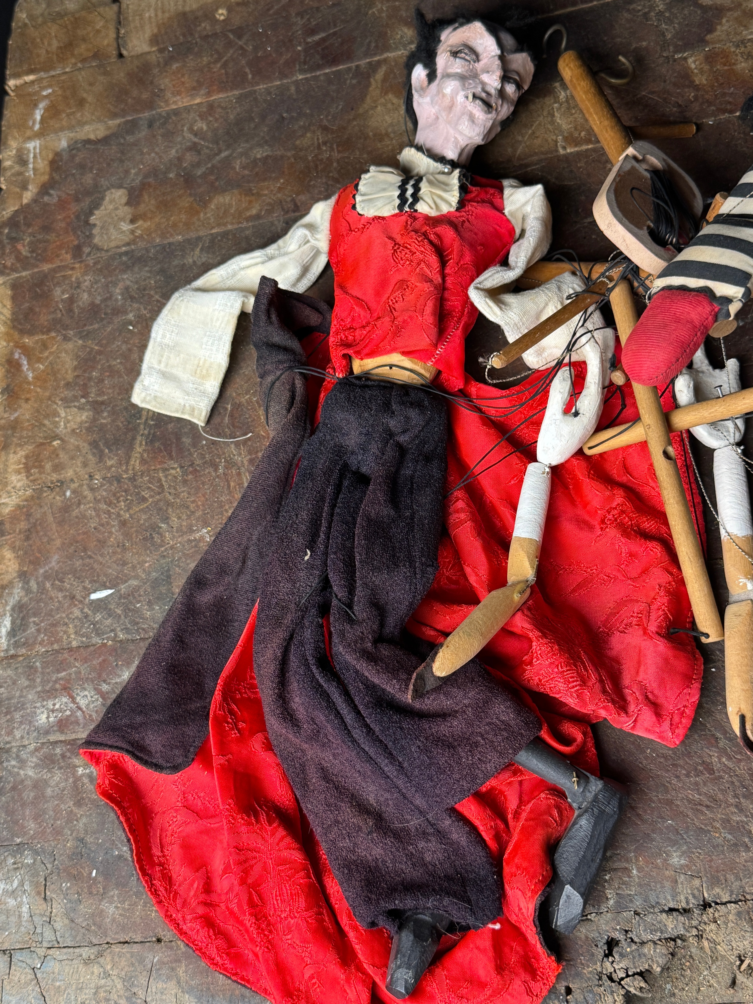A Pair of Vintage Composition and Wood Marionettes Featuring Vampire and Sad Clown Characters