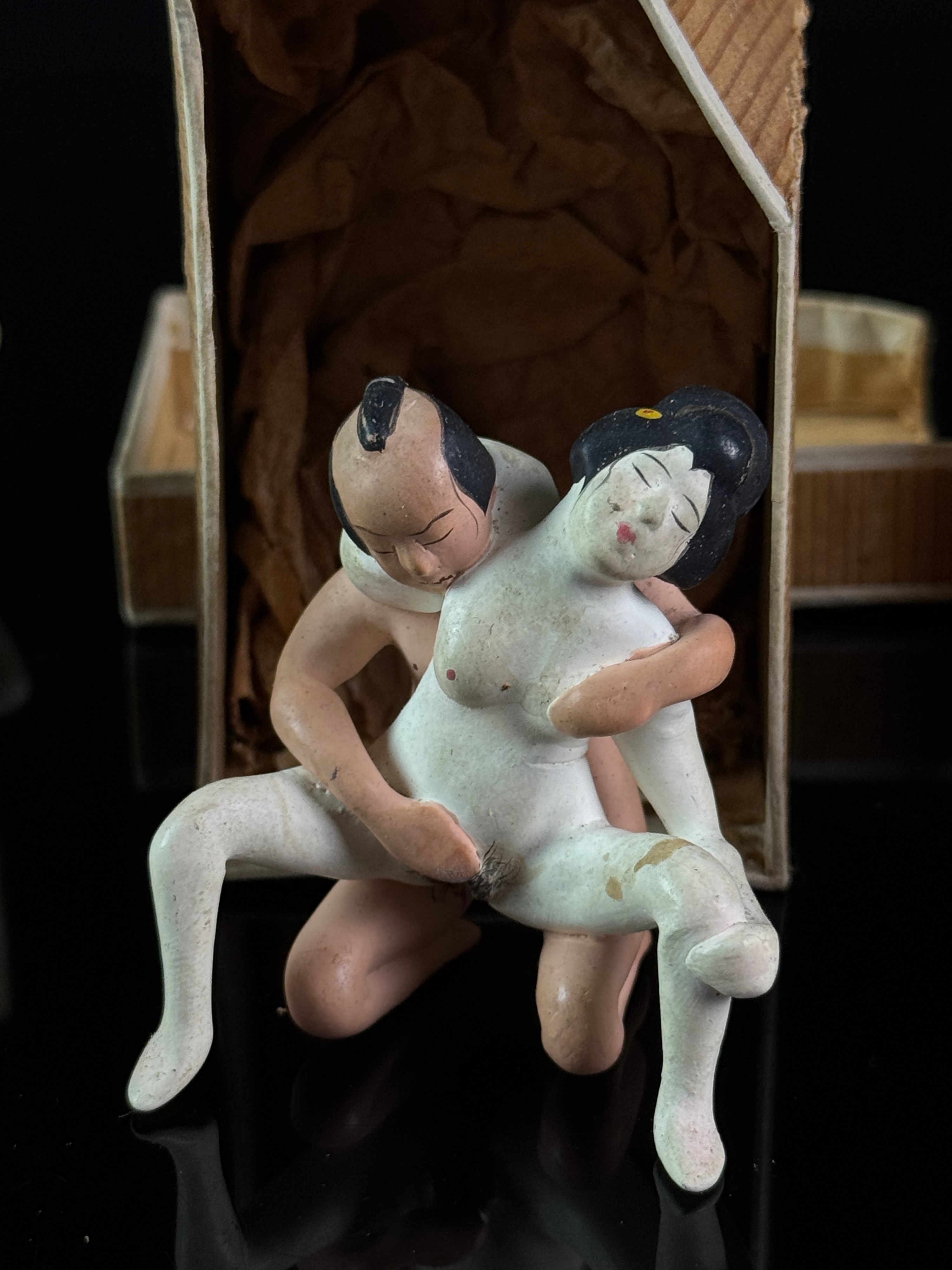 A Set of Six Miniature Hand-Painted Biscuit Porcelain Erotic Figural Groups in Boxes