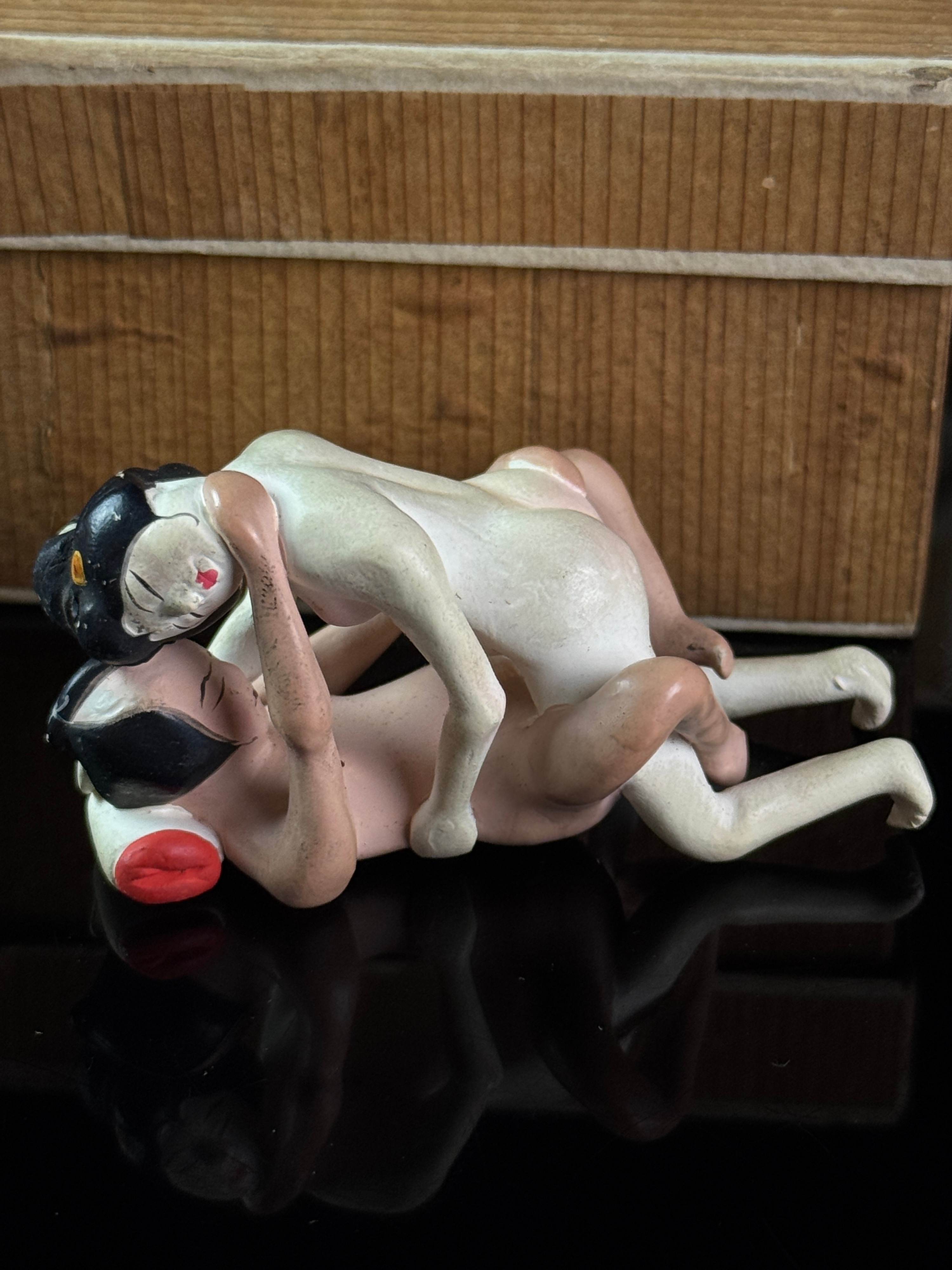 A Set of Six Miniature Hand-Painted Biscuit Porcelain Erotic Figural Groups in Boxes