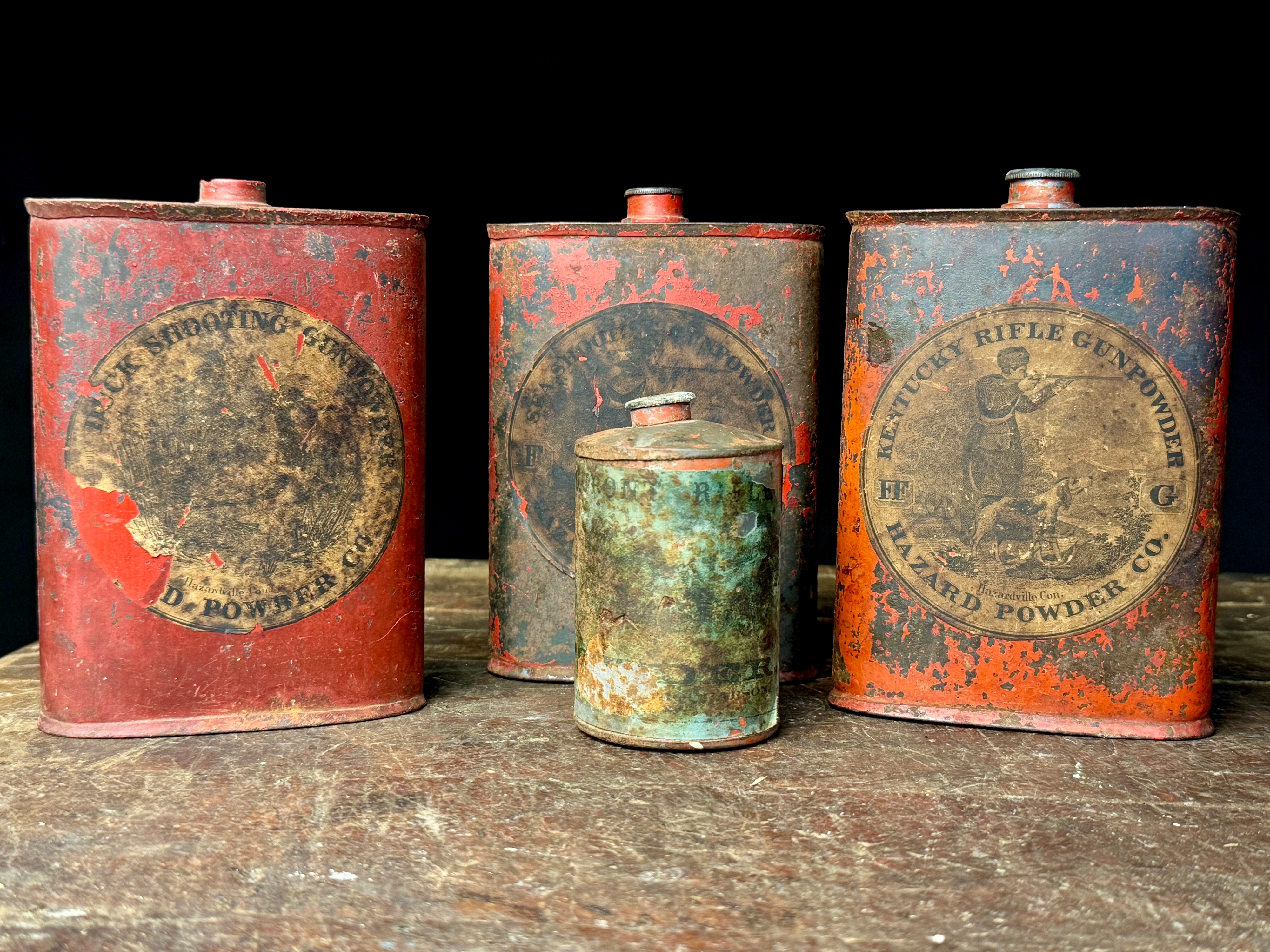 An Assortment of Antique Hazard Powder Co. and DuPont Gunpowder Tins