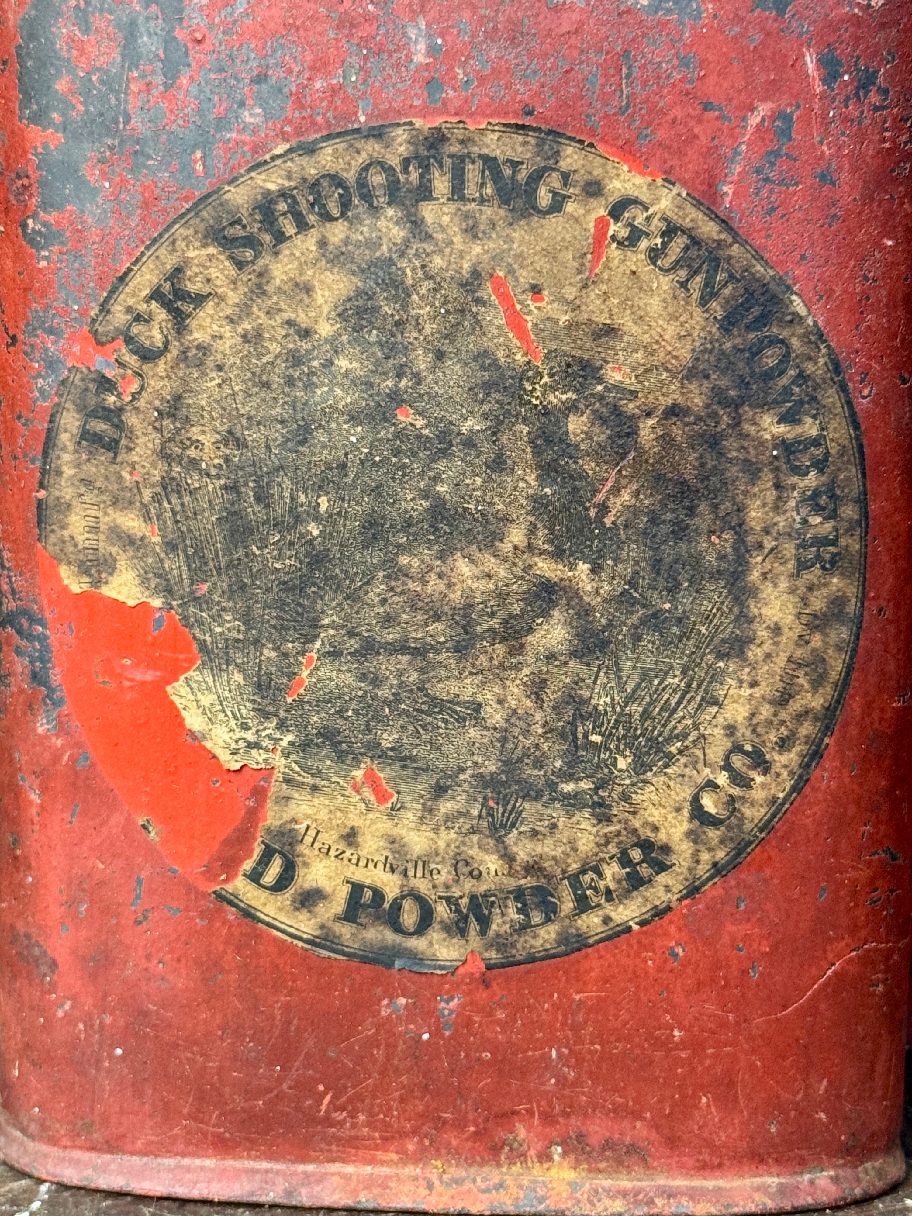 An Assortment of Antique Hazard Powder Co. and DuPont Gunpowder Tins