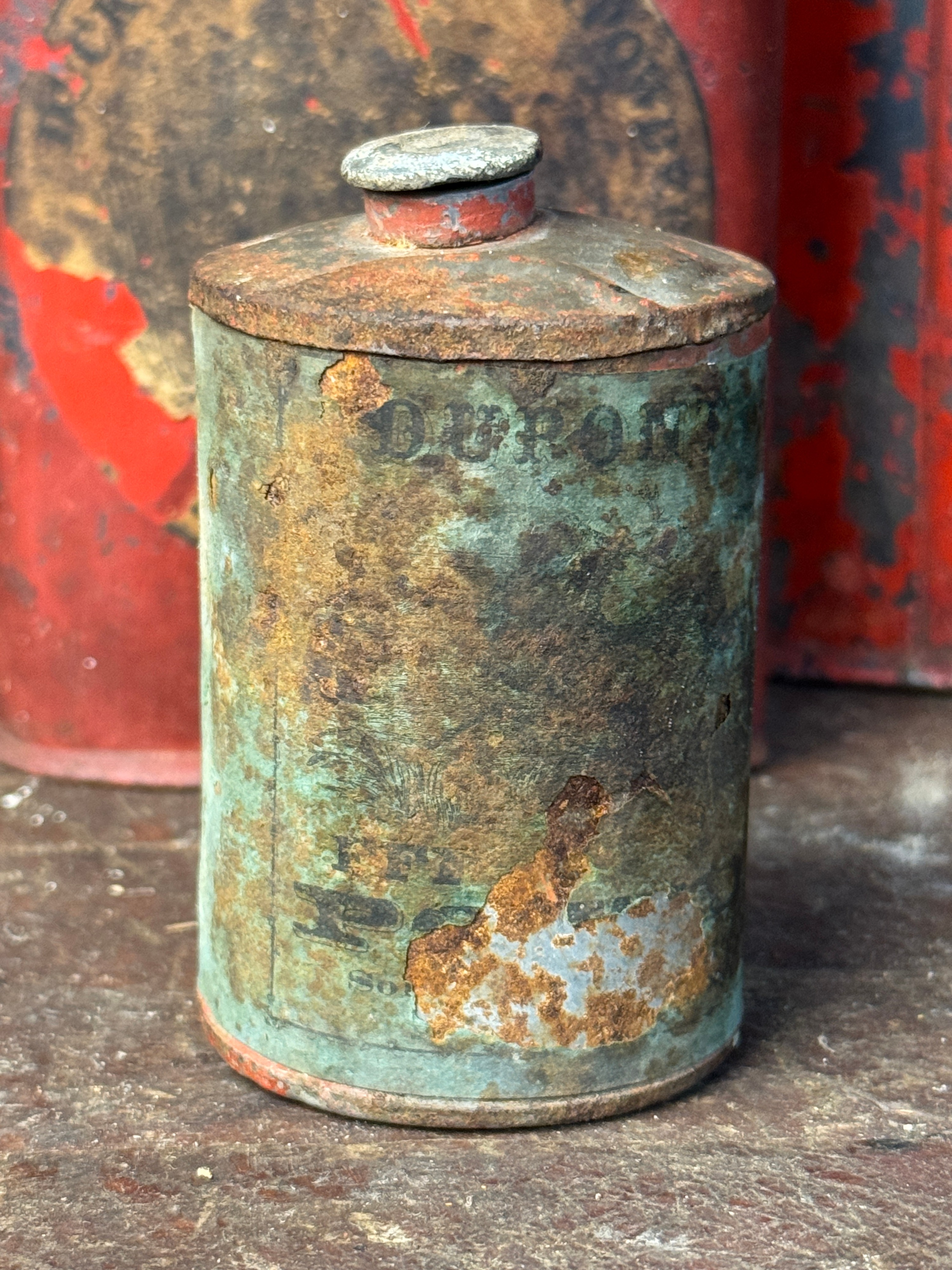 An Assortment of Antique Hazard Powder Co. and DuPont Gunpowder Tins