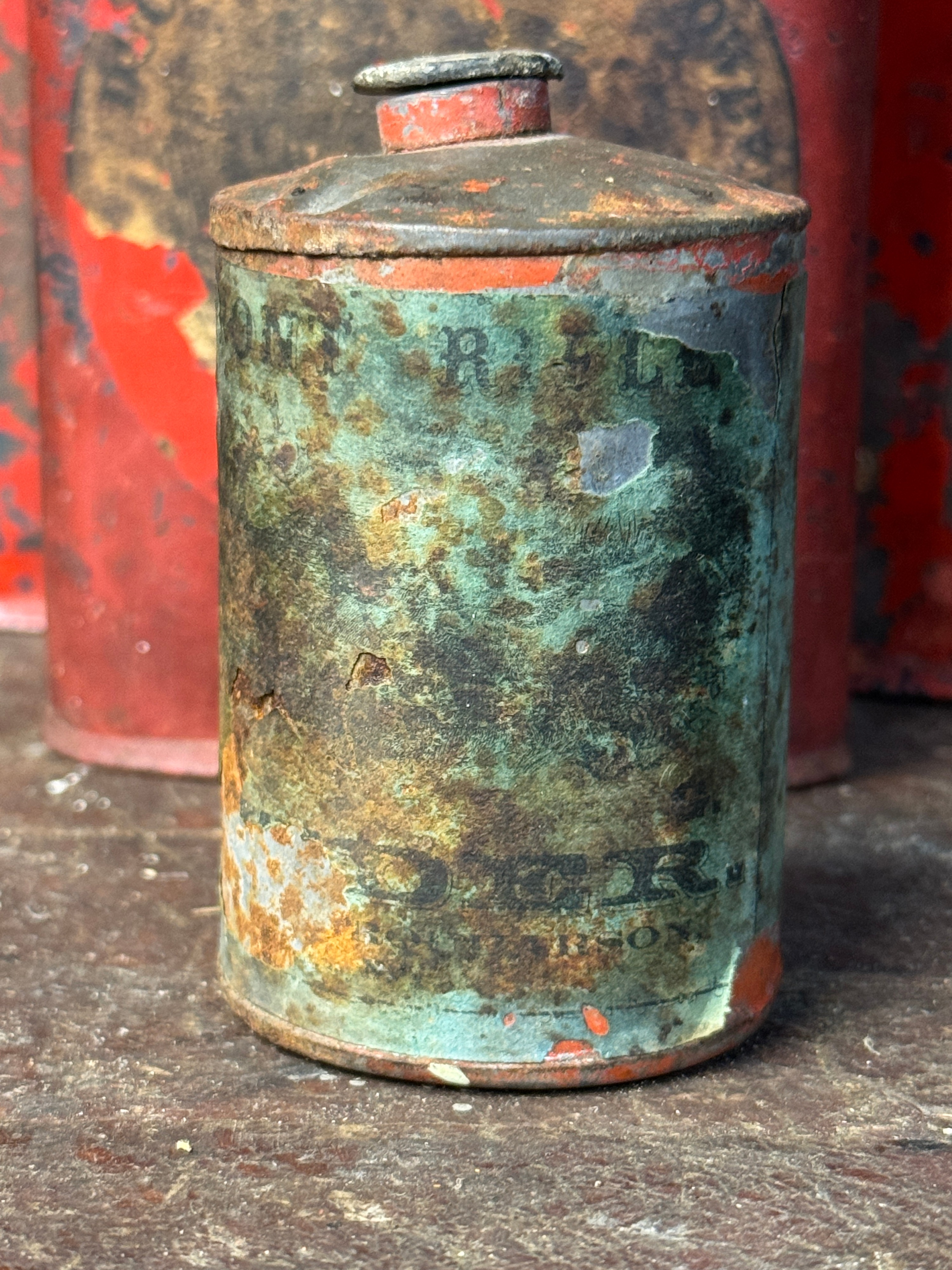 An Assortment of Antique Hazard Powder Co. and DuPont Gunpowder Tins