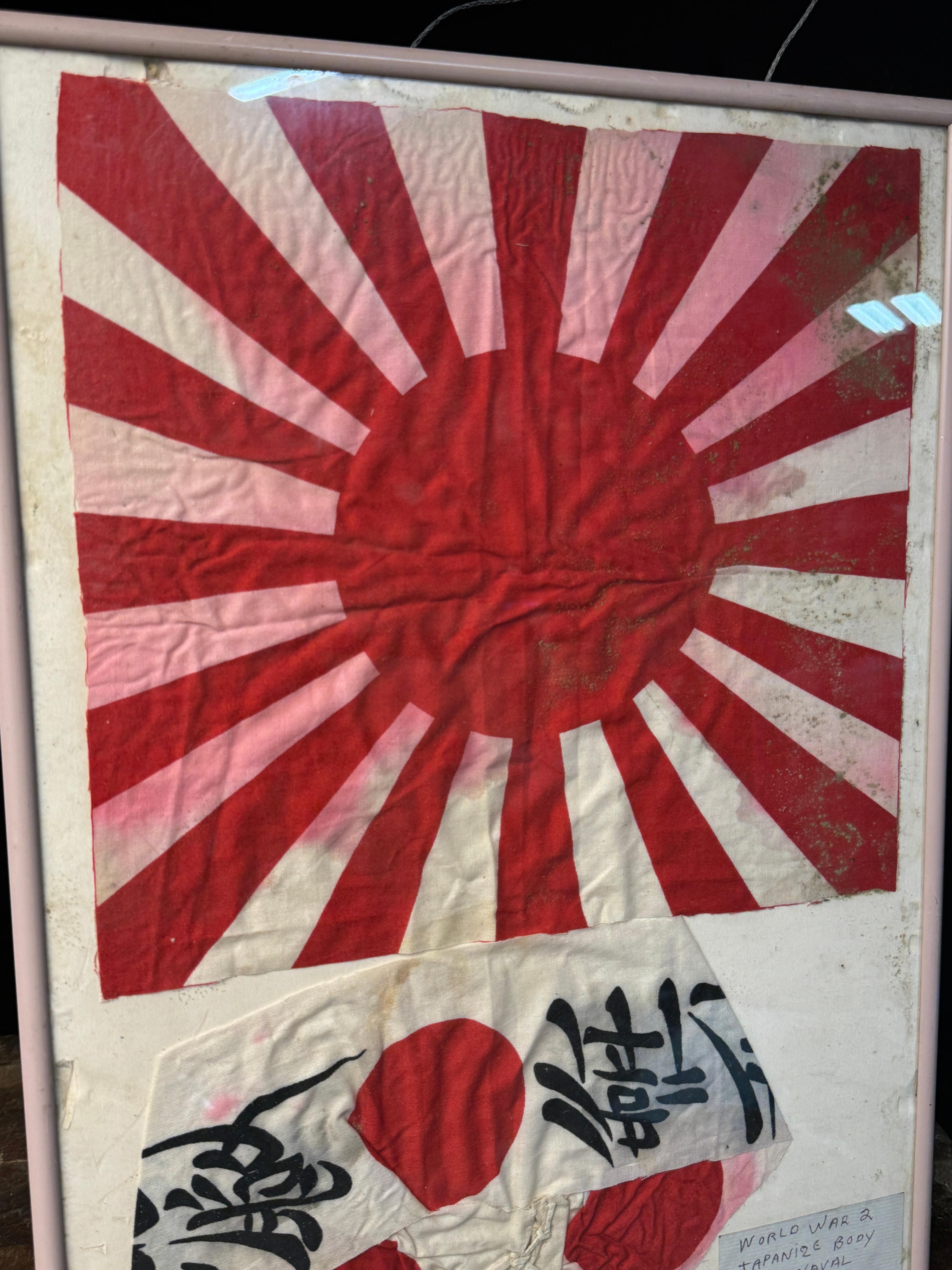 Two Framed World War II Imperial Japanese Textiles Including a Rising Sun War Flag and Kamikaze Hachimaki