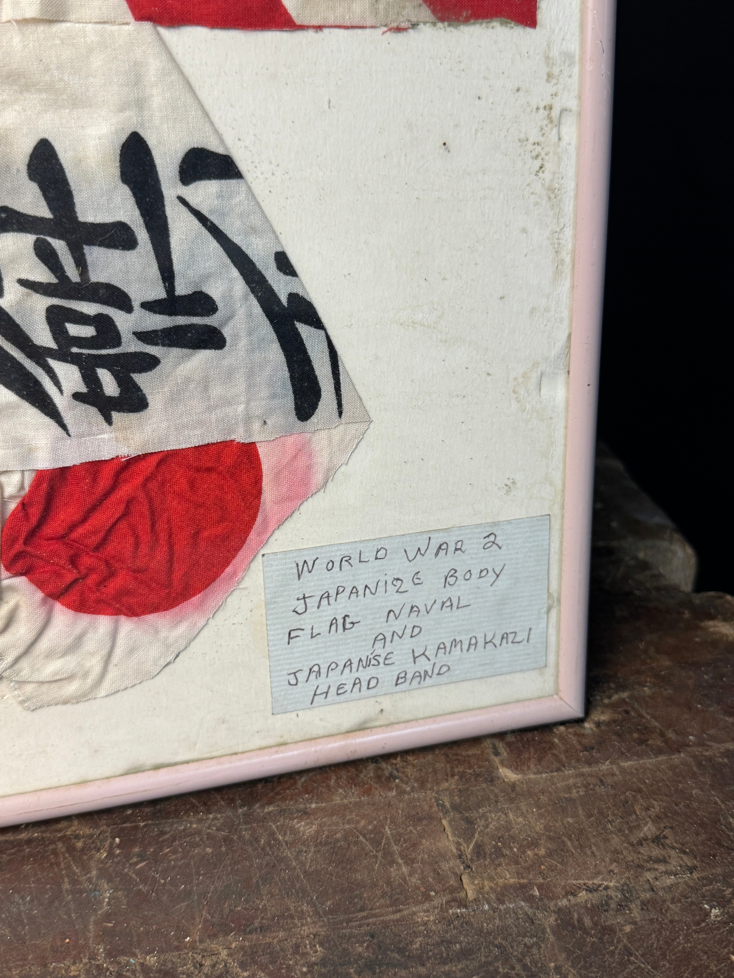 Two Framed World War II Imperial Japanese Textiles Including a Rising Sun War Flag and Kamikaze Hachimaki