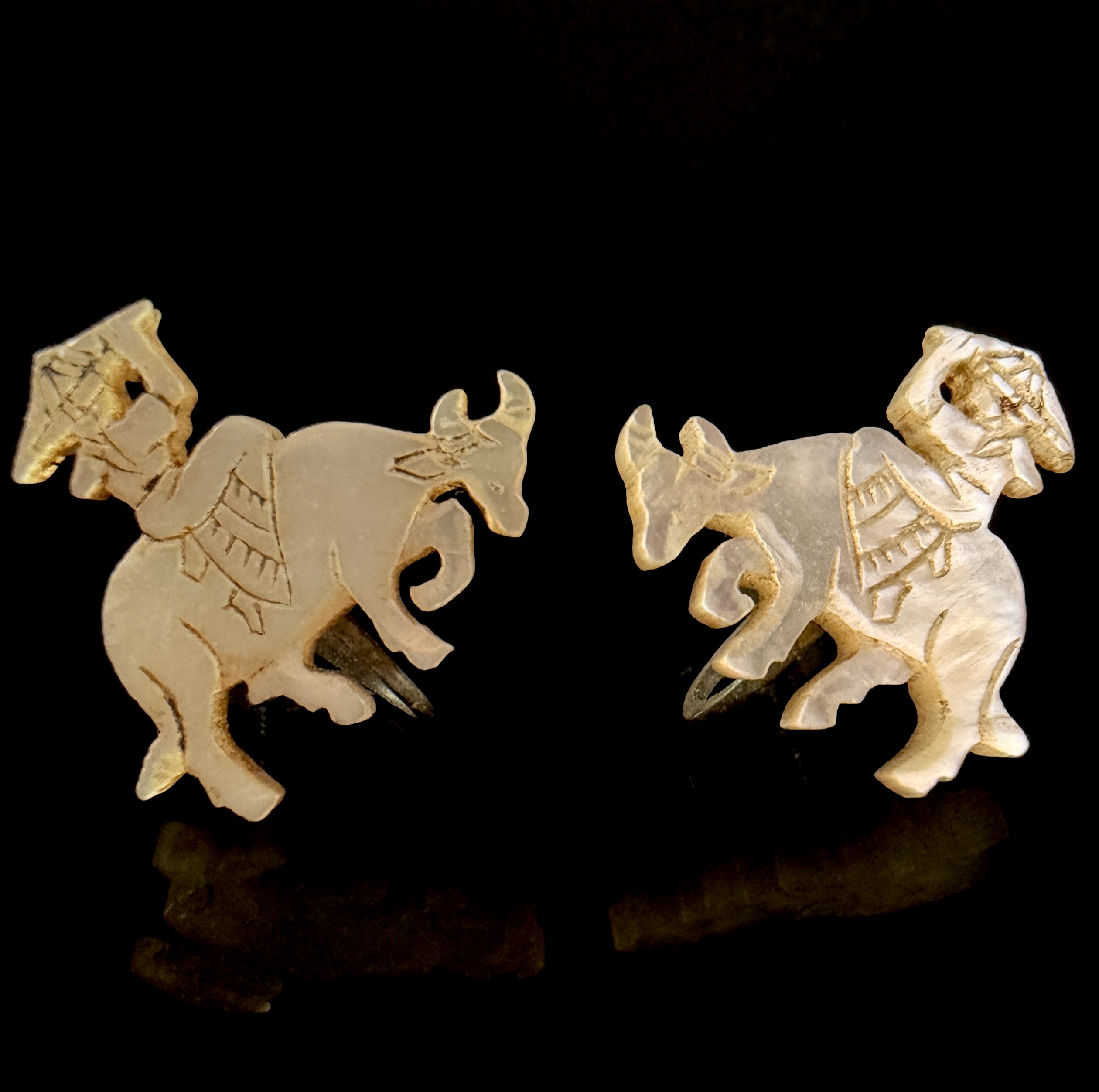 A Pair of Japanese Hand-Carved Mother-of-Pearl Water Buffalo Earrings