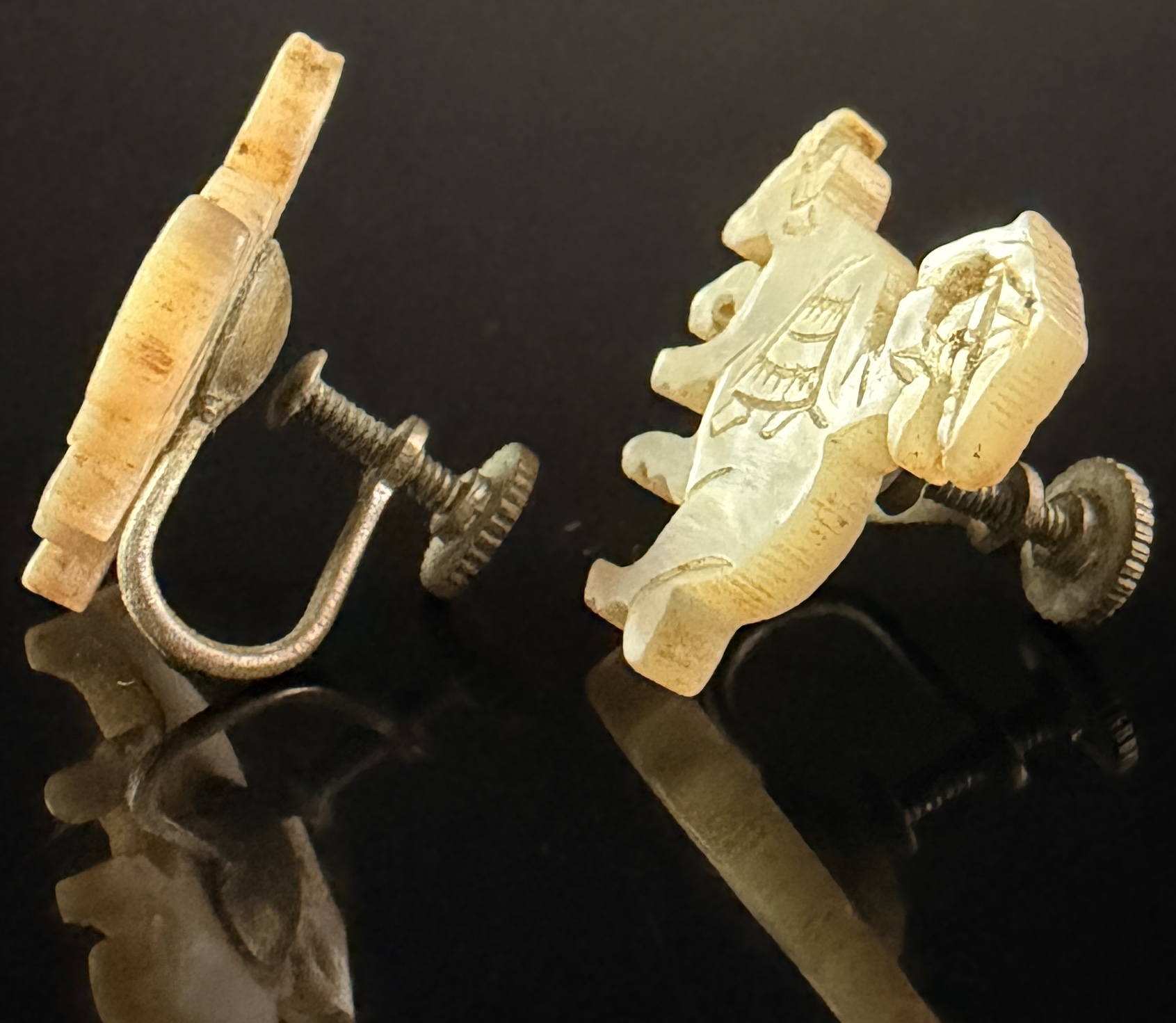 A Pair of Japanese Hand-Carved Mother-of-Pearl Water Buffalo Earrings