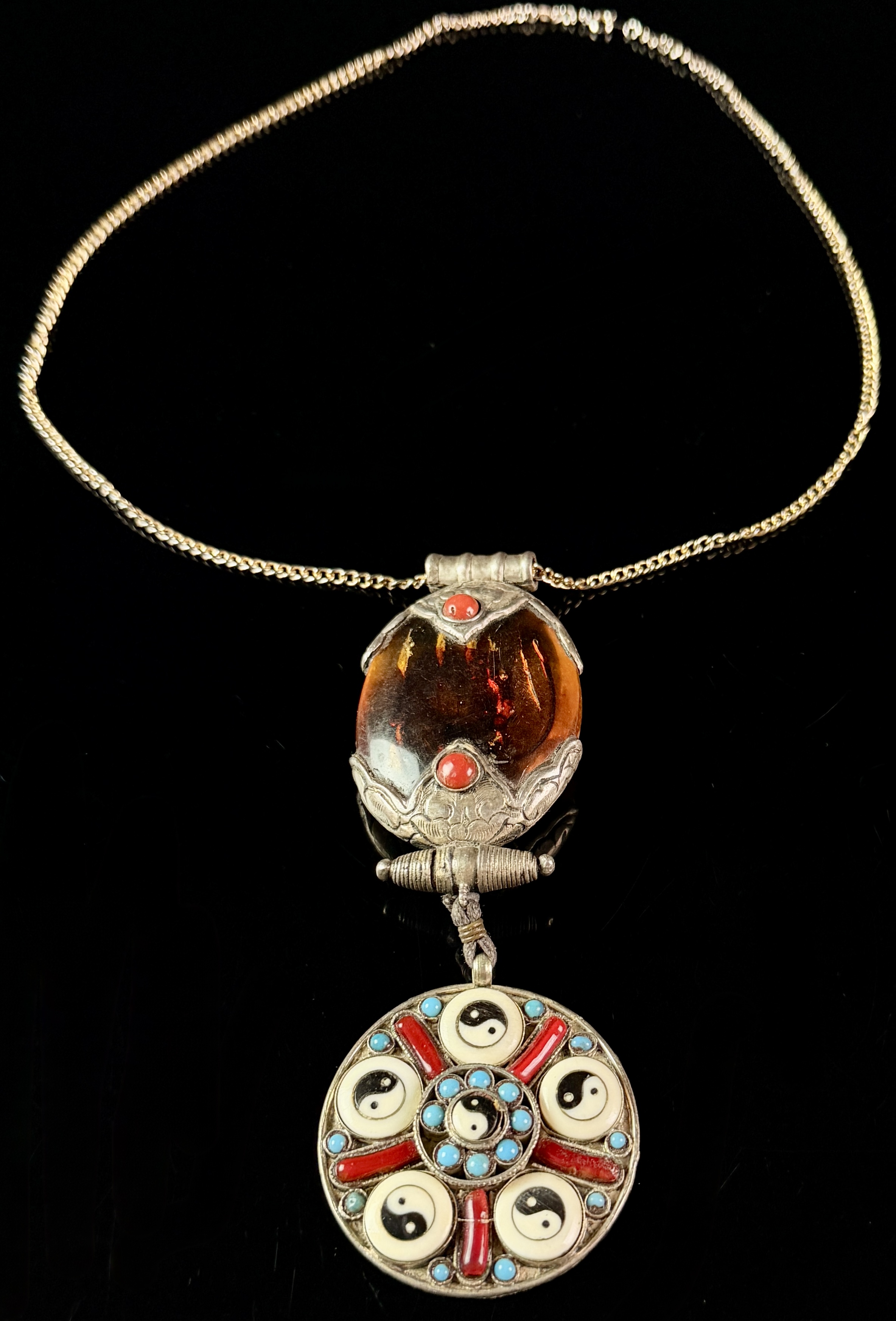 Tibetan Style Articulated Silver Toned Pendant Necklace with Amber Coral and Turquoise