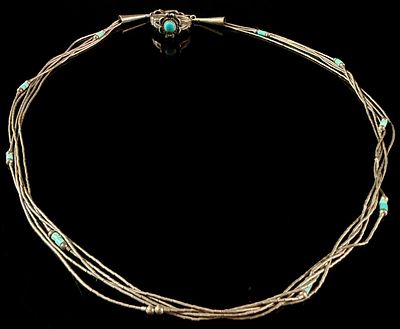 A Navajo Lot of Sterling Silver and Turquoise Jewelry Comprising a Multi-Strand Necklace and a 