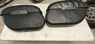 A Pair of Harley-Davidson Rigid Locking Leather Wrapped Hard Motorcycle Saddlebags. A pair of 