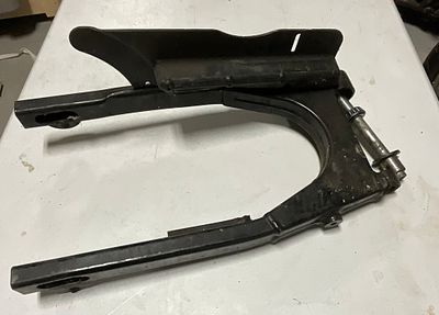 Rear Swingarm Assembly for Motorcycle with Pivot Axle and Chain Guard. A used rear swingarm 