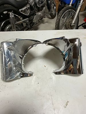 A Pair of Chrome Motorcycle Headlight Nacelle Shroud Halves. A two-piece set of motorcycle 