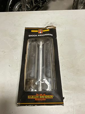 A Pair of Custom Chrome Shock Absorbers for Harley-Davidson Motorcycles. A pair of chrome-plated 