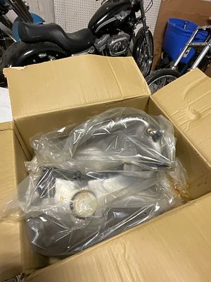 A Set of Chrome Specialties Fat Bob Style 5.0 Gallon Motorcycle Gas Tanks Part Number 260131. A 