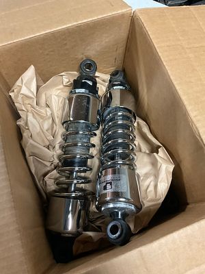 Two Sets of Progressive Suspension and Unbranded Motorcycle Rear Shock Absorbers. A set of four 