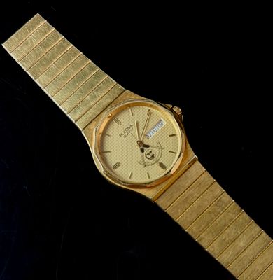Bulova Masonic Emblem Quartz Day-Date Integrated Bracelet Wristwatch. A gold-electroplated base 