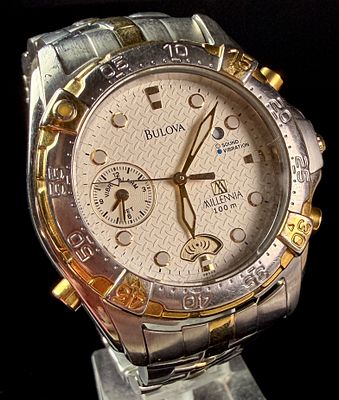 Bulova Millennia Two-Tone Vibrating Alarm Wristwatch. A Bulova Millennia wristwatch featuring a 