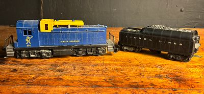 Two Lionel O-Gauge Model Railroad Pieces Including an Alaska Railroad Diesel Switcher and a 