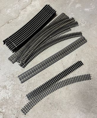 A Collection of HO Scale Model Railroad Track Sections Including Straight, Curved, and Flex Track. 