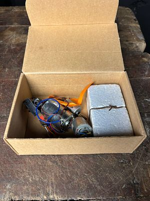 A Collection of Small DC Electric Motors and Electronic Components. An assortment of small 