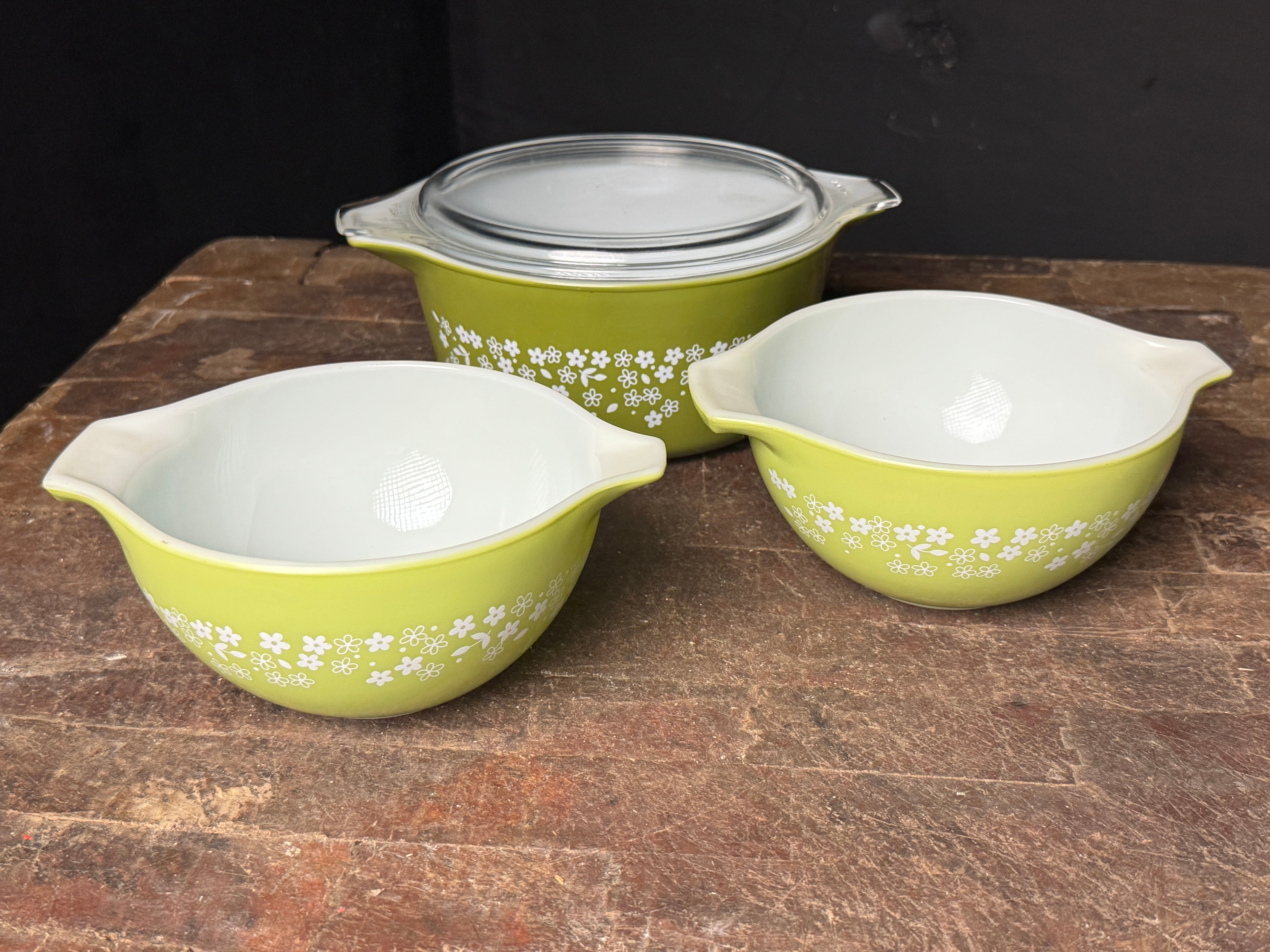 A Trio of Pyrex Spring Blossom Green Ovenware Including Nesting Bowls and a Casserole Dish