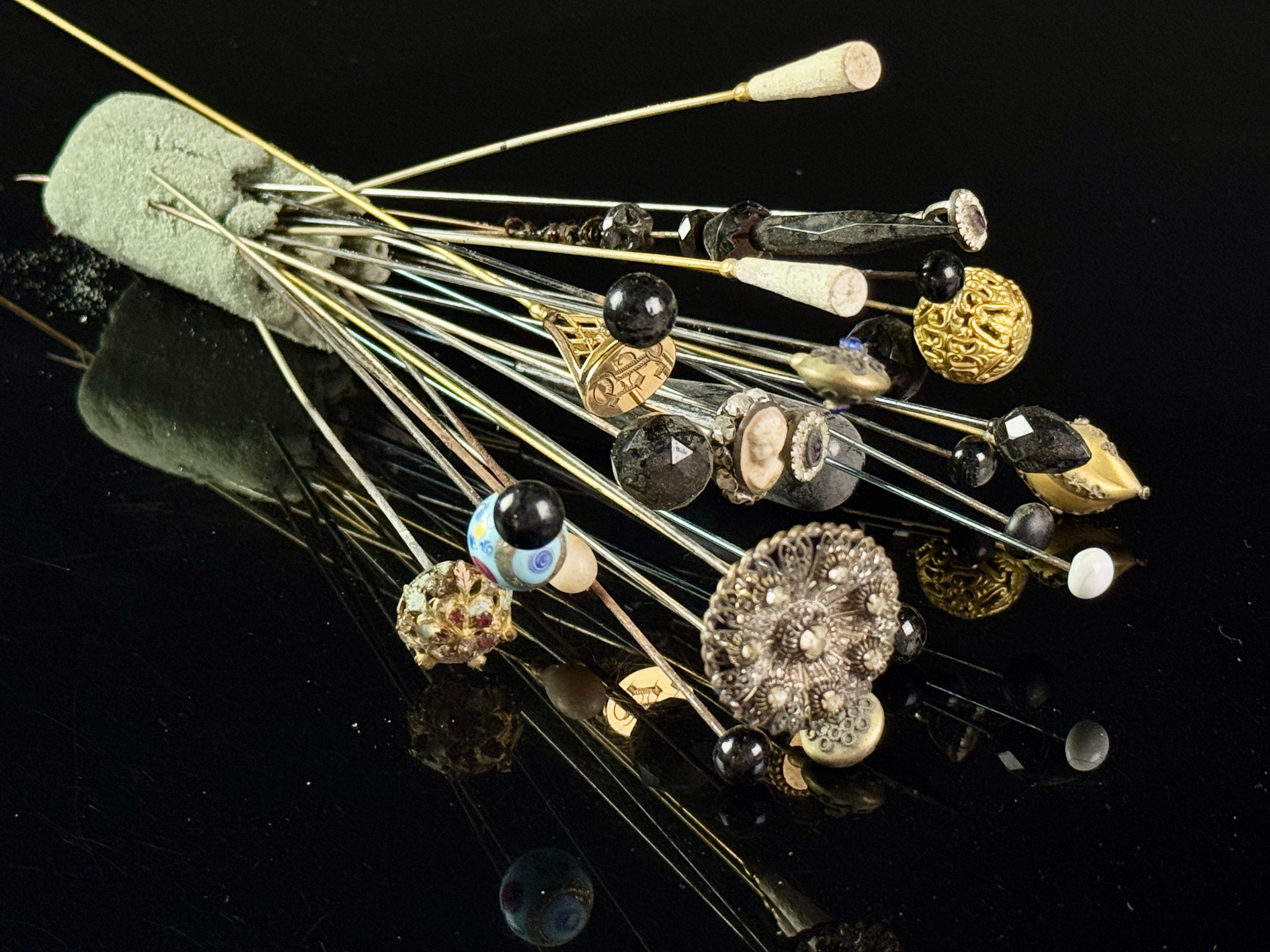 An Assortment of Antique Victorian Hat Pins and an Art Nouveau Folate Stick Pin