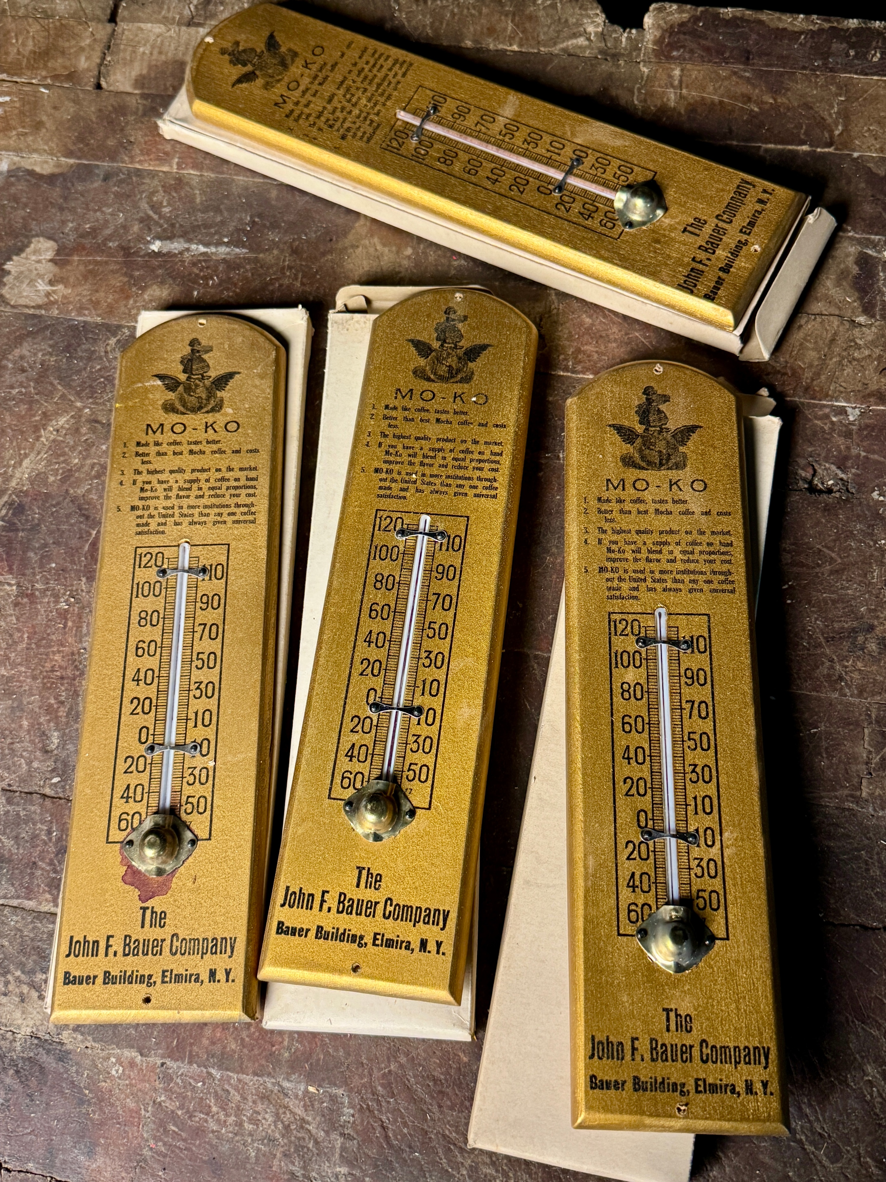 An Assortment of Vintage Mo-Ko Coffee Substitute Advertising Thermometers