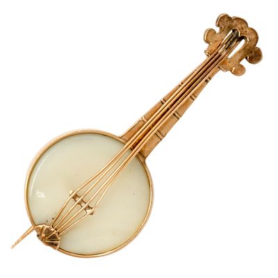 14k Rose Gold Banjo Brooch. 
Set with a white gemstone (moonstone?). 
Marked. 
Length: 