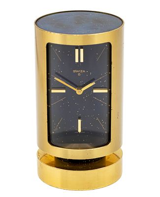 שעון שולחני מעורר Swiza. 
מנגנון מכני, שמונה ימים, מצב עבודה. 
מנגנון מעורר, מצב עבודה. 
מסגרת 