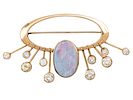 14k Yellow Gold Opal and Diamond Brooch. 
Oval opal - 18x12mm. 
Eight diamonds in total weight Image - 1