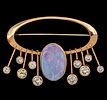 14k Yellow Gold Opal and Diamond Brooch. 
Oval opal - 18x12mm. 
Eight diamonds in total weight Image - 2