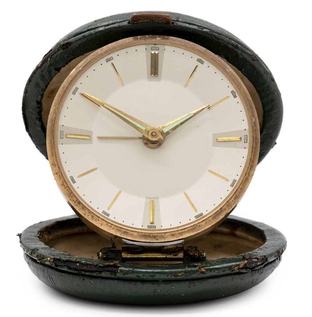 Mercedes Folding Alarm Clock. 
Probably a marketing clock given by the automobile company. 