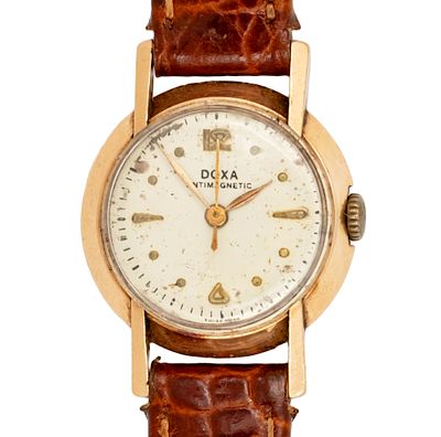 שעון יד לאישה Doxa זהב 14 קראט. 
מנגנון מכני, מצב עבודה. 
רצועת עור. 
24מ"מ.