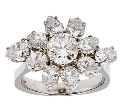 14k White Gold Diamond Ring. 
Center diamond of about 1ct, SI clarity, G-H color. 
10 pear cut 